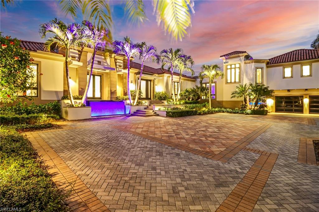 The Gulf of Mexico just a few steps away and 115 feet of direct waterfront Bay living. Behind the gated entry, beyond the palm trees is a sprawling Architectural precise estate that was completely redesigned in 2013. The moment you walk through the front door, it is evident that no detail was spared by the designers of this four-bedroom, four-and-one-half bathroom, study and 4,247 square feet of easy Naples living. Imported marble and limestone throughout the home, two kitchen islands with Quartz waterfall counters make for a gourmet kitchen like none other! Panoramic views of Venetian Bay, dual master suites, chef-inspired kitchen, open living room, expansive lanai, and multiple balconies.  A private pool, sitting areas, many outdoor living spaces that overlook the Bay. Enjoy the spacious Lanai with retractable automatic screens and for those chilly evening, gas fire pits.  Smart home capabilities allow for easy living with automated interior blinds, mood-setting lighting system, surround sound, a projection screen, and a security system.  Also, just steps away from the beach, your private deeded beach access.   This home is available for your immediate enjoyment.