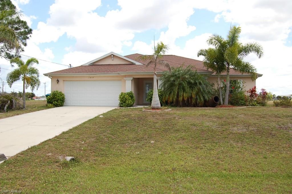 This is a 3 bedroom 2 bath with den Heated Pool Home located on a 3 lot site.  Home is located across the street from the NW Cape Coral Softball Complex Park! Mariner High School and Middle School less than a mile away.   Solid Surface Counter Tops in the kitchen.  Designer Tile Floors thru out living area and Brazilian Wood Floors in the bedrooms.   Open Floor Plan with Under Truss Lanai in Enclosed Pool area.  Priced to Sell!