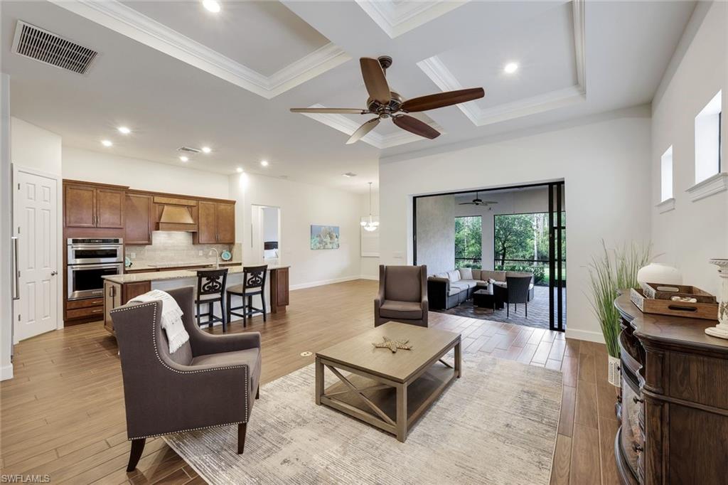 Exceptional 2018 Preserve-View Home in Gated Somerset at The Plantation Your lifestyle of a lifetime awaits! Meticulously maintained Summerwood model with full storm protection plus located in 'X' flood zone so no flood insurance required. Newer home translates to being built with strongest building codes and better insurance rates. No storm history and Sellers insurance is under $1k/year! This move in ready single-family home offers 3 bedrooms, 2 bathrooms plus a spacious den. 2,020 square feet of bright, open-concept living (3,200 square feet overall with extended garage and extended front patio). Situated on a premium lot that backs directly to lush preserve for unmatched privacy and peaceful views. Inside, you’re greeted by gorgeous plank tile flooring, soaring coffered and tray ceilings, crown moldings and elegant plantation shutters. The chef-inspired kitchen is a standout, featuring upgraded granite countertops, a large center island, custom cabinetry, stainless steel appliances, double oven and a generous walk-in pantry. The open great room flows seamlessly, creating a warm and inviting space for family and friends. Step outside to enjoy Florida living at its finest on the extended paver lanai overlooking the preserve, complete with Storm Smart privacy screens. Additional premium features include an extended garage with epoxy flooring, whole-house water filtration system, brand-new professional landscaping, and a charming covered front porch with park-like views. The lifestyle at Somerset in The Plantation delivers unparalleled resort-style living with low HOA fees.The Amenities Center features: tennis(league play), pickleball, two pools, spa, bocce, billiards, party room, fitness center and yoga, landscape maintenance, two annual mulchings, grass cutting, lawn irrigation, Wi-Fi, cable, community activities, Zumba and other floor exercises, library, and meeting rooms - plus direct access to The Plantation’s 18-hole championship golf course (membership optional). Just minutes from Southwest Florida International Airport, Gulf Coast beaches, Gulf Coast Town Center shopping, top dining, and world-class attractions ~ this location truly has it all including great neighbors on both sides! This partially furnished home is truly move-in ready and represents a wonderful opportunity to own in one of Fort Myers’ most desirable gated golf communities. Schedule your private showing today!