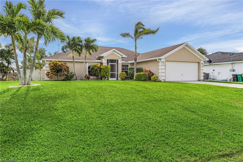 *Motivated Seller* Immaculate move-in ready home in a fantastic location of SW Cape Coral. This spacious 3 bedroom + den, 2 bathroom home boasts 1824 sqft and has an inviting open floor plan with vaulted ceilings and split bedrooms.  It’s the perfect size for a primary residence, relaxing vacation home, or an investment property. This charming home has been meticulously maintained and features a newer roof/gutters, new water heater, and a new AC.  As you step inside you’ll appreciate the spacious main living area which has high ceilings, and is great for entertaining and spending time with family and friends. This beautiful home has all hard surface flooring - no carpet, and has been tastefully updated including the large kitchen which has stainless steel appliances and stunning granite countertops. Enjoy the sunshine from your screened in lanai that overlooks a large fenced in backyard which is private and perfect for pets. It’s in a great location close to shopping, dining, and close proximity to the highly rated Ida S. Baker High School. All assessments are in and have been paid, NO flood insurance required, this home is in a quiet neighborhood and is ready for its new owners.