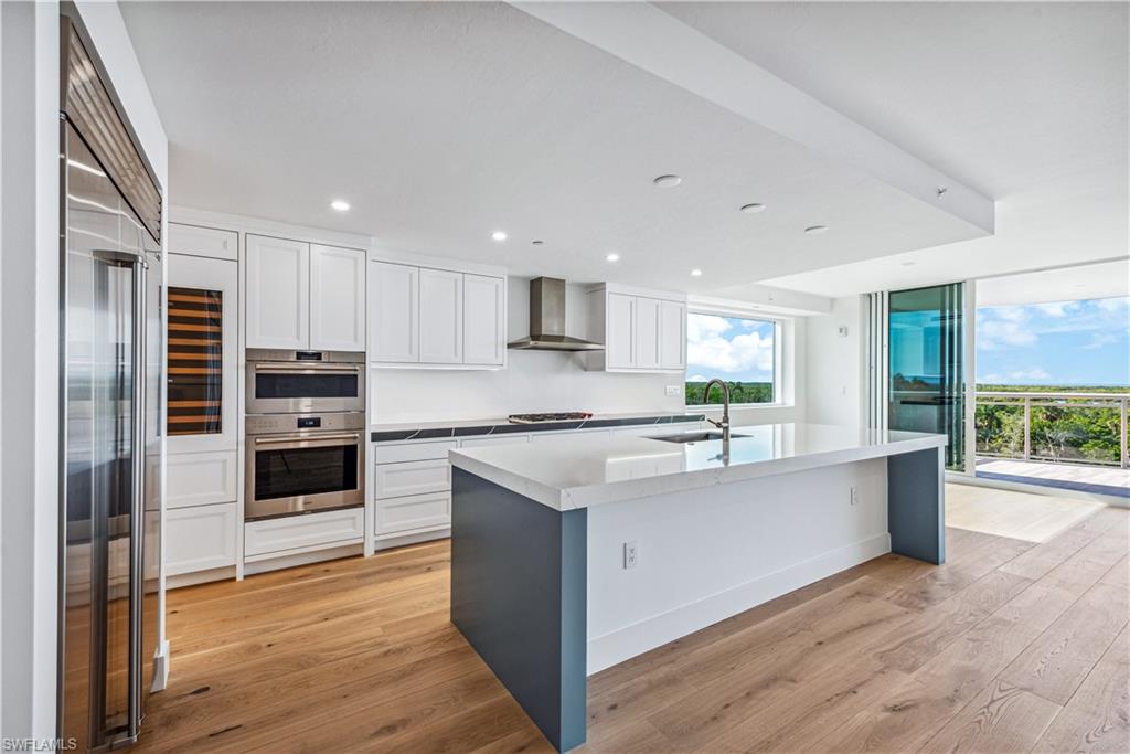 BRAND NEW TOWER! TOWER 400 JUST COMPLETED!  Beautiful 5th-floor southern end unit in Kalea Bay Tower 400 offers an expansive residence exceeding 3,200 square feet under air. The 4 bedroom 4 bathroom unit features a private elevator and an open floor plan that showcases a seamless expansive living area. This unit epitomizes indoor-outdoor living with its extensive lanai, glass railings, and sliding glass doors.  Floor-to-ceiling windows and doors frame breathtaking views of the intercostal waterways and the Gulf of Mexico. The kitchen is designed to delight any chef, equipped with a natural gas cooktop, Wolf and Subzero appliances, a built-in double oven, large island a butler’s pantry, and LED lighting throughout. The owner’s suite offers a spa-like retreat with premium fixtures and a walk-in closet. The unit has never been occupied and comes with all developer warranties, transferring to the new owner; all ready for your finishing touches.  Tower 400 features a rooftop pool, an open-air fitness center and social room.  Kalea Bay residents also enjoy access to the exclusive Club at Kalea Bay where you will enjoy drinks from the poolside bar, engage in paddle boarding, and take advantage of over 100,000 sq ft of resort amenities dedicated to socializing, health, and wellness. Experience a lifestyle you've only dreamed of at Kalea Bay.