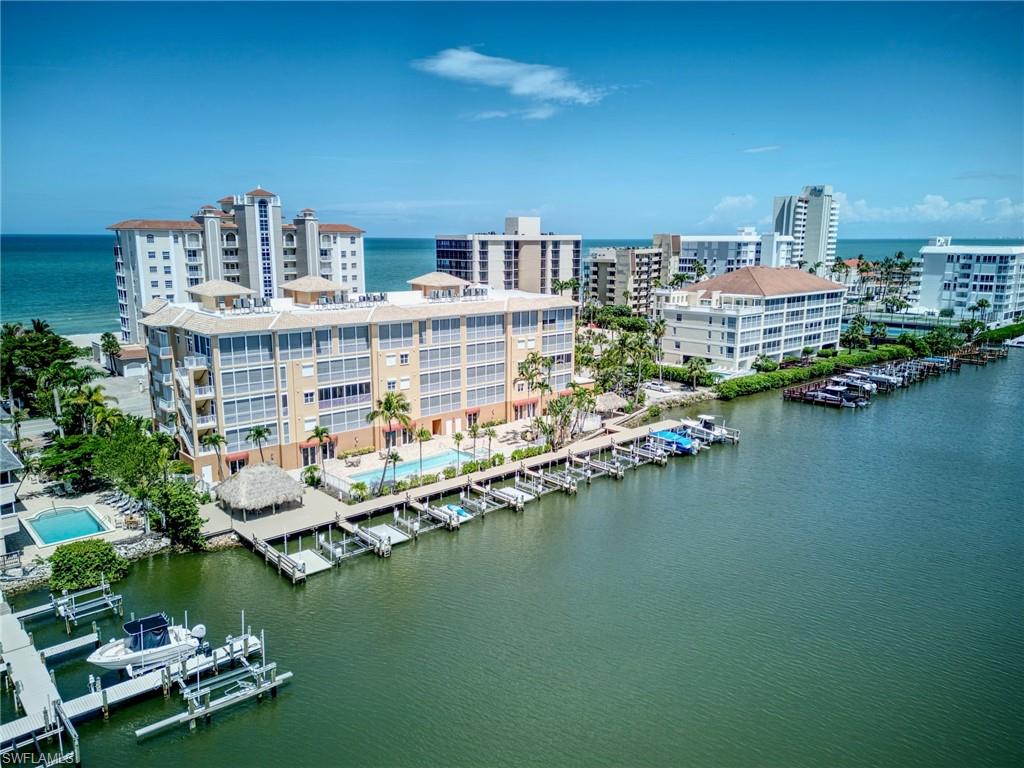 Stunning Penthouse with incredible Gulf & bay views! Corner residence with 12 ft volume ceilings & a private elevator that opens into your foyer. Immaculate 3 bedrooms plus a separate den/office & 3 baths. Main bedroom has wide bay views & the en-suite guest rooms are enjoined by a Gulf view terrace! New kitchen with custom cabinetry & granite tops, rich wood flooring & hurricane shutters. Spacious living room opens to a wall of glass to the expansive 47 foot lanai overlooking the wide bay. It’s so gorgeous it will take your breath away!
Small enclave of only 19 residences near the Ritz Carlton. Complete your beach & boating life style with fabulous amenities including 30 ft dock/lift & private poolside cabana with full bath, heated pool/spa, 2 Chickee huts with bar & TV, BBQ station, secured lobby and under building parking. The turquoise sea and the white sugar sand are just footsteps away! Pets- 2 dogs up to 25 lbs. Enjoy!