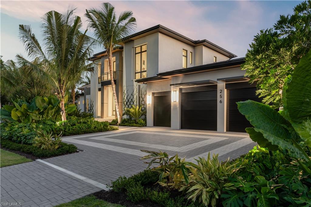 London Bay and award-winning Romanza Interior Design have collaborated once again to create this fantastic opportunity in one of the most desirable locations in Naples. The home features a seamless connection between the indoor and outdoor living spaces along with an interior design ideal for easy everyday living and entertaining. The light filled open great room plan includes a club room near the thoughtfully designed primary wing providing the ideal private retreat. Take the private elevator to enjoy the second floor loft space that is surrounded by three spacious guest suites, additional laundry and balcony overlooking the pool/spa and lushly landscaped yard. Additional noteworthy features include an elevated generator, air-conditioning units, and tankless water heaters, all with the convenience of natural gas serving the property. This property is ideally located on a quiet street where the beach is just steps away and only a short distance to all of the shops and dining Third Street South has to offer.