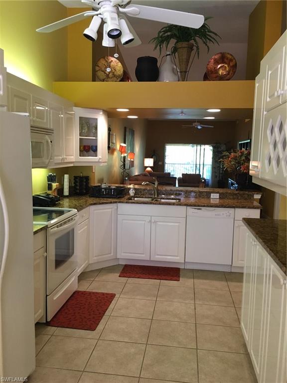Richly appointed and designed for total comfort, this three bedroom, two bath end unit is situated in a quiet section of the highly desirable Falling Waters community. You will be impressed with the lovely granite Kitchen counters and white cabinets, upgraded appliances and even a built-in wine rack. Over-sized tile in all rooms except the three bedrooms ensures ease of care and maintenance. The huge Master Bedroom seamlessly accommodates a king-sized bed with plenty of room for other furniture. The adjoining Master Bath has dual sinks, large walk-in shower, and separate water closet. A wrap-around lanai faces a landscaped area with flowering trees and shrubs, creating a perfect place to relax with your favorite beverage at the end of a fun-filled day. This unit has a detached one car garage just a few feet from the front door. Falling Waters, with its many waterfalls along the main road of the community, has a huge resort-like pool and a newly decorated Clubhouse. Approximately six miles east of Downtown. Naples is renown for it's exciting restaurants and world-class white sandy beaches.