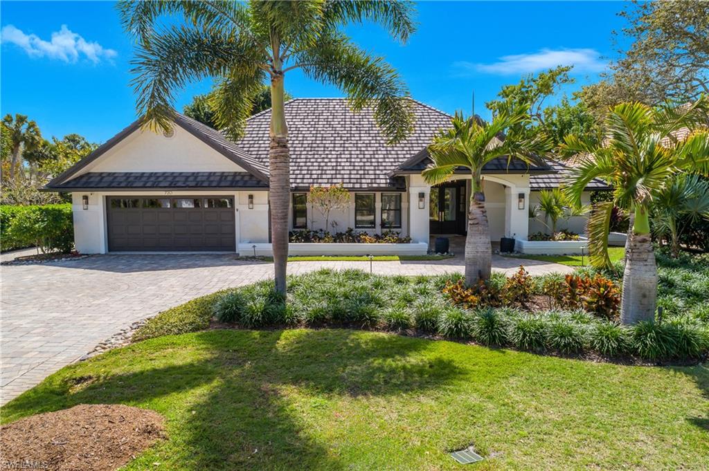 Situated on a corner lot in Oakmont with professional landscaping, lighting and gracious curb appeal is this outstandingly renovated residence in the ideal community of Pelican Bay. In addition to 3 bedrooms, 3 full baths , family room and office/den with a Murphy bed, the residence offers a spacious covered lanai with outdoor kitchen overlooking a heated, saltwater pool with hot tub, floating sundeck, dual waterfalls and fire feature.  The chef's kitchen features a 12 foot island and 48 inch gas cooktop.  The open flow living room has custom vaulted ceiling detail, the office/den has a built-in Murphy bed, the fireplaced family room includes a wet bar.  Throughout is the Legno Bastone wide-board flooring, Sonos sound, Lutron lighting, camera security system and central vac.   The Pelican Bay community is without equal, there's nothing like it! Beach access with attendant provided beach chairs, umbrellas, etc.,  The two private beach restaurants have indoor and outdoor dining, sports bars and takeout.  There are exercise classes and entertainment both at the beach and at the community center. There is a top notch tennis program and pickleball has arrived at Pelican Bay.  The Artis Philharmonic and Baker Art Museum are in the community as well as The Waterside Shops with restaurants and retail options for all with additional shopping, restaurants and movies nearby.  The Club Pelican Bay requires separate membership. Buyers to pay the Pelican Bay Foundation fee of $10,000 at closing.