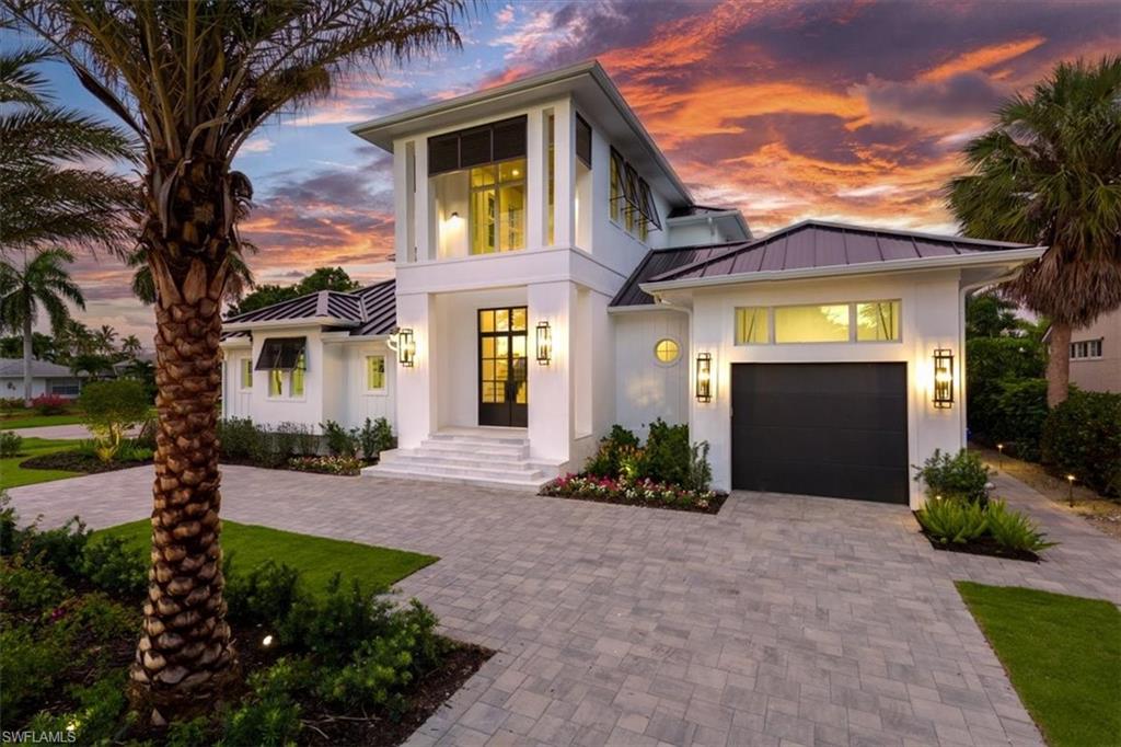 NO WATER from Helene or Milton - High and Dry **WINNER of the prestigious Sand Dollar Award for BEST Kitchen and BEST Design** Introducing the only opportunity of its kind in Naples: A chance to acquire a new construction, never-lived-in, exquisitely furnished residence on navigable water in this price range. Unparalleled luxury and design, as envisioned by Broad Avenue Studios, and brought to life by MHK Architecture and C&E Builders, awaits in this 4,470 sq. ft. waterfront haven in Royal Harbor, one of Naples’ most sought-after enclaves. Set mere minutes from the beach and downtown's vibrant 5th Avenue, this property brings together all of the qualities of a first-class Naples location where you can enjoy shopping, dining and sunsets within minutes of your front door. Your backyard becomes your launchpad to the Gulf of Mexico, plus you are just 6 minutes to Naples Executive Airport. Thoughtfully curated down to every detail, the interiors combine 4 ensuite bedrooms, a den and 6 baths with generous living spaces, a gourmet kitchen with butler's pantry and a striking bar with black metal and glass hanging shelves. Rich wood tones, architecturally-detailed ceilings, reeded cabinetry, bright marble coating on the counters, matte black metal accents, and polished chrome fixtures create an unforgettable backdrop for upscale living and entertaining by the sea. Beyond, a sun-drenched Florida room, summer kitchen, and heated pool/spa surrounded by a wood deck, complete the picture of this chic-yet-tranquil Naples retreat.