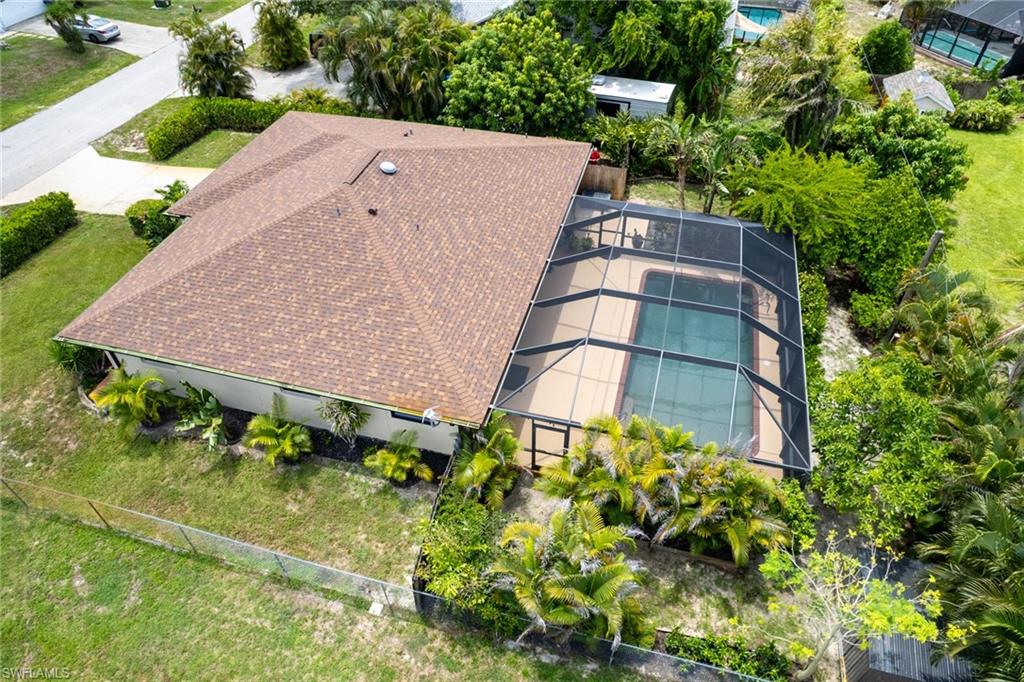 One or more photo(s) has been virtually staged, AI generated or rendered.  Privacy and Outdoor-Living of its best! Enjoy an oversized Pool-Area with a lot of privacy, provided by beautiful landscaping and a fence around the property. Get inspired by a welcoming wooden floor that guides you into this home. A lot of space, as Family Room, Living Room and an open Dining and Kitchen Area are well separated.
The Master Bedroom Suite with friendly laminate flooring has its own patio, facing the backyard lawn and the two good sized guest bedrooms are comforting you also in Laminate flooring. Your open Kitchen- and Dining Room Experience starts with a granite Countertop bar and provides Stainless-Steel appliances. Get your peace of freedom with a Roof from 2024, a newer A/C, a new water system, as well as move-in condition of the house as well.
Get your showing set up today and prove for yourself that this feels home from the first moment on!
You are close to shopping, Restaurants, short distance to schools and the Fort Myers International Airport and got a community park just minutes away!