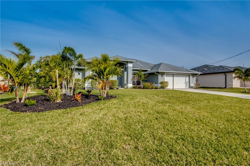 Enjoy your favorite beverage pool side in this western exposure waterfront home.  Located in the Surfside neighborhood with gulf access and one bridge. Boat dock includes a remote control lift for 7500 pound boat. Large heated salt water resurfaced pool with extended outdoor living space.  The updated island kitchen with open floorplan to the vaulted ceiling family room make entertaining an ease. Both bathrooms are updated and exterior and interior are freshly painted.