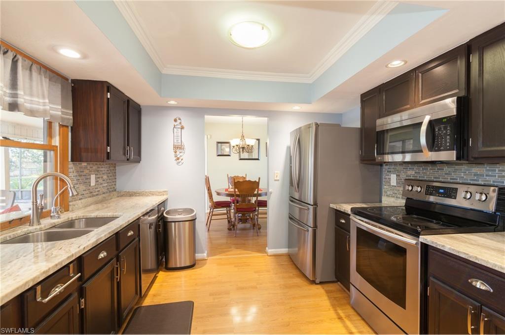 You are going to fall in love with this 3 bedroom, 2 bath, 2 car garage,  pool home that offers a built in shed for additional storage.  From the brick facade out front to the adorable family room, this house has been lovingly updated over the years. Featuring two separate living rooms, a dining room, a recently updated kitchen & a huge covered lanai, this home is the perfect setting for raising a family or retiring in peace.  Large walk in closet in the master bedroom.  Both guest rooms also offer walk in closets.  Newer appliances in the kitchen.  Brand new roof.  The water heater, dishwasher & microwave were replaced in 2017.  Conveniently located near the Pine Island Shopping Corridor.