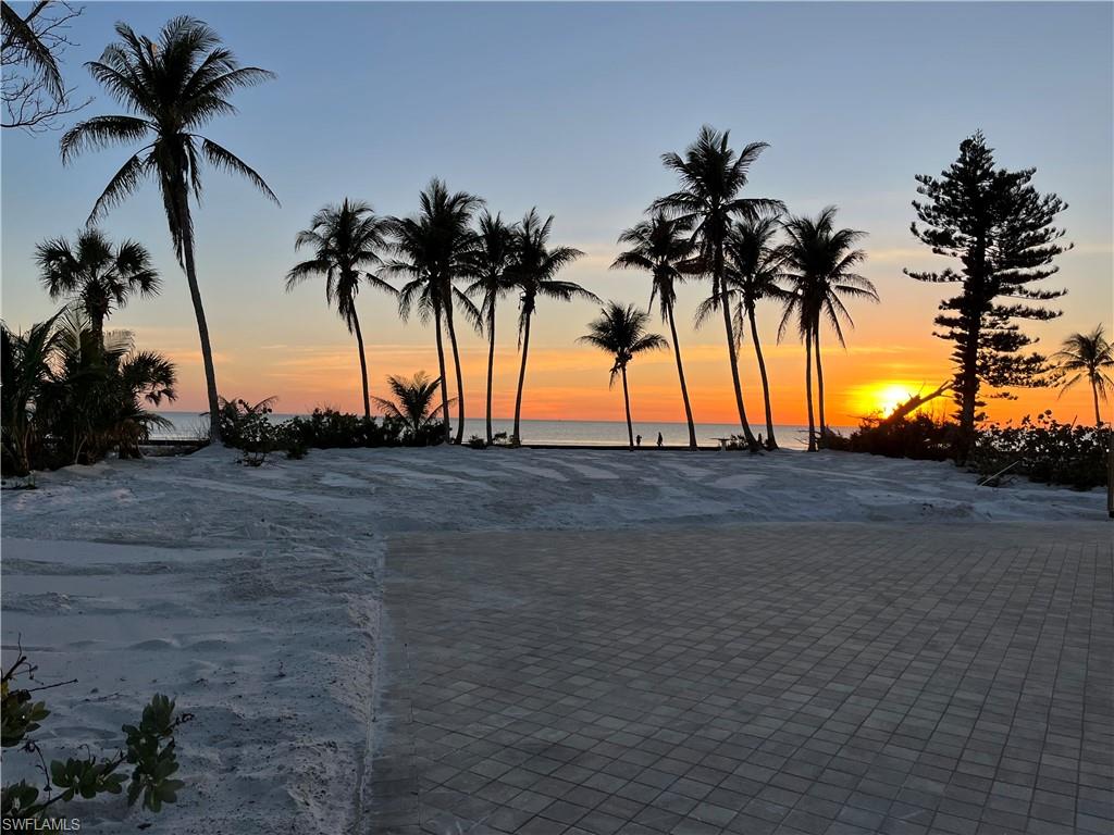 Discover the perfect canvas for your dream coastal estate with this stunning .549-acre gulf-front lot, boasting an impressive 100 feet of direct beach frontage on Fort Myers Beach. Ideally suited for a generational home, this expansive 100-foot-wide property offers ample space to create a luxurious retreat for family and friends, complete with breathtaking Gulf of Mexico sunsets just steps from your door.

Located mid-island, this prime lot is easily accessible from the north via Bonita Beach or the south via the bridge, striking the perfect balance between convenience and tranquility. Enjoy proximity to grocery stores, dining, and retail, while savoring the peace of a quieter stretch of Estero Island.

Surrounded by mature coconut palms and native tropical plantings, the property exudes island charm and provides a serene backdrop for your custom-designed beachfront home. An existing paved driveway adds immediate functionality, and the generous lot size offers endless possibilities for creating your ideal estate. A lot survey and architectural conceptual package from MHK Architecture will be available soon, providing valuable insights for your vision.

Preliminary discussions with the Town of Fort Myers Beach Planning Department indicate potential for lot division, making this a versatile opportunity for investors, builders, or those seeking to craft their own coastal sanctuary. Embrace the ultimate beachfront lifestyle in one of Southwest Florida’s most coveted locations.