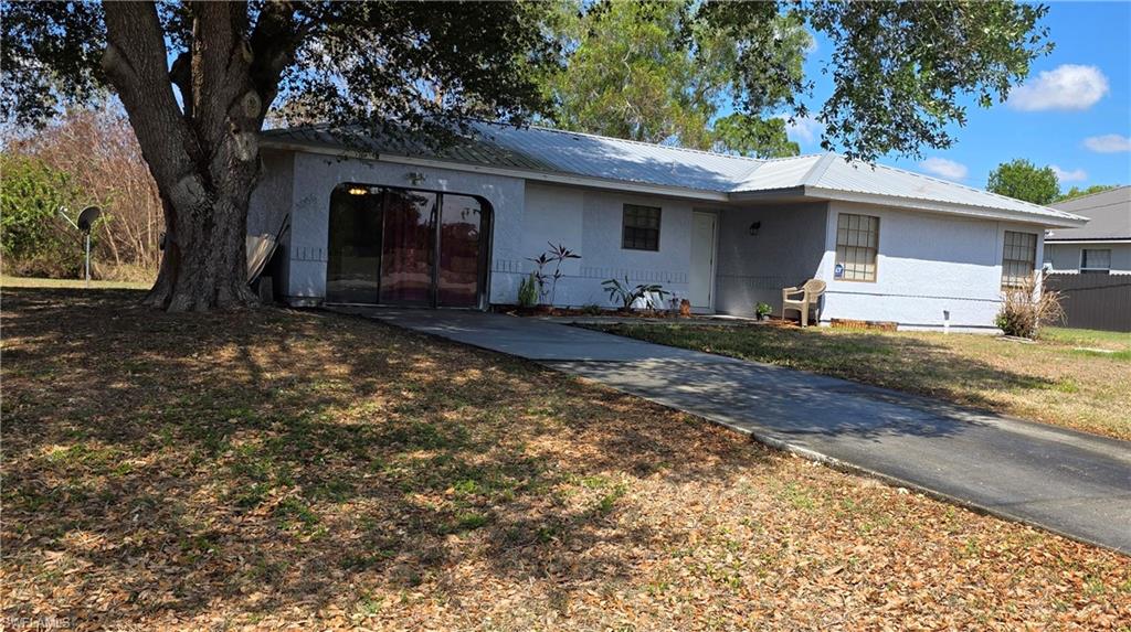 Back on the market due to buyer financing falling through—no fault of the seller!

Welcome to this beautifully maintained 3-bedroom, 2-bath home in the desirable Port LaBelle community. This move-in-ready property features an updated kitchen and bathrooms completed in 2020, offering modern style and everyday functionality. Tile flooring throughout the home provides a clean, cohesive look while making maintenance a breeze.

Major updates include a new electric panel and water heater (2025) and a durable metal roof installed in 2018, providing added value and peace of mind for years to come.

A versatile bonus room, fully tiled and under air, offers endless possibilities as a home office, playroom, media room, or additional living space. Outdoors, you'll find raised planter boxes perfect for gardening, growing vegetables, or creating your own backyard oasis.

Whether you're looking for a primary residence, seasonal retreat, or investment opportunity, this property checks all the boxes. Conveniently located near schools, shopping, and local amenities, this Port LaBelle home is ready for its next owner.

Schedule your showing today!
