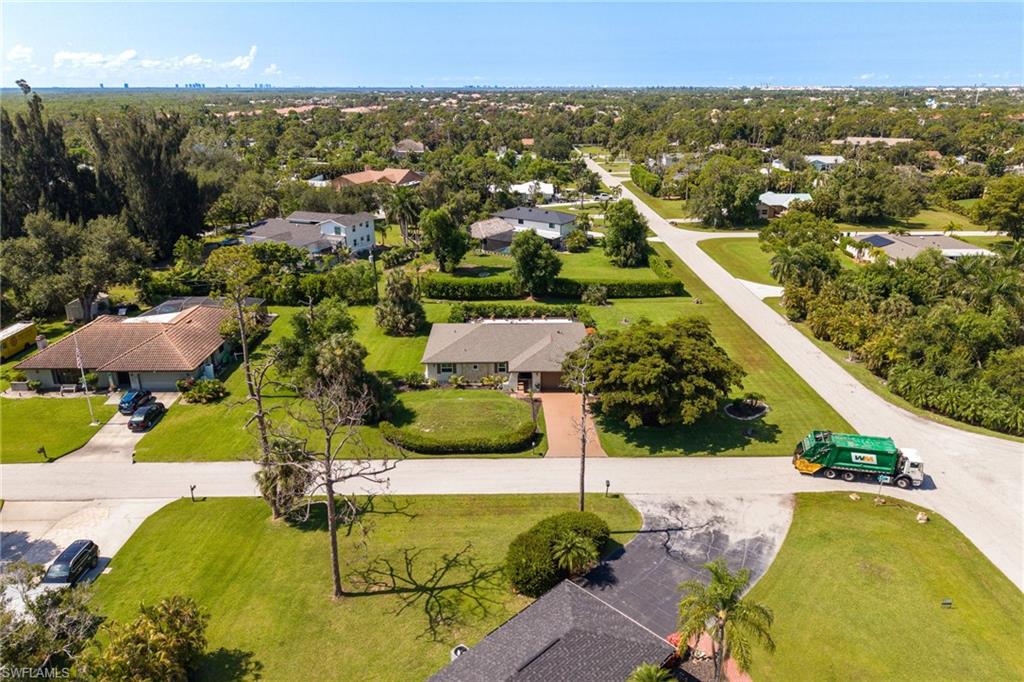 Beautifully remodeled Fort Myers pool home on an oversized corner lot of more than half an acre in the highly desirable Heritage Farms community. This home offers the lifestyle so many buyers are looking for: space to spread out, privacy to relax, and a central Fort Myers location close to shopping, dining, downtown, beaches, RSW Airport, and everything Southwest Florida has to offer. From the moment you enter Heritage Farms, you are welcomed by oak-lined streets, estate-style homes, and a peaceful neighborhood setting. Inside, the inviting foyer opens to a bright, spacious floor plan with multiple living areas, travertine stone and tile flooring throughout, upgraded thermal windows and doors, plantation shutters, custom electric roll-down shades, and oversized sliders that bring in natural light and showcase beautiful views of the outdoor living space. The remodeled kitchen and baths feature solid wood shaker cabinetry, waterfall quartz countertops, and timeless finishes. Additional updates include renovated plumbing, updated electrical, dimensional shingle roof, reverse osmosis system, and more. The spacious primary suite offers pool access, a custom walk-in closet, and a beautifully remodeled bath with a large walk-in shower. Step outside and enjoy true Florida living with a huge renovated pebble pool, spacious covered lanai, and plenty of lounging space for relaxing, entertaining, hosting family and friends, or enjoying quiet evenings at home. With its oversized lot, gorgeous updates, private outdoor setting, and unbeatable Fort Myers location, this Heritage Farms home is a must-see.