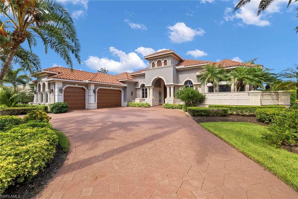 Rarely available and highly coveted single-story floor plan in the heart of the Vineyards. With nearly 4,500 square feet of living space, the home includes formal living & dining rooms, a Chef's kitchen, family room, 4 bedrooms with ensuite baths, den, powder room & an attached 3-car garage. Relax and enjoy spectacular golf course views from the fully screened expansive covered lanai with lounging & dining areas, outdoor kitchen, fire pit, and infinity edge pool and spa. Owner's retreat features a spacious bedroom, sitting area, dual vanities, oversize shower, bidet & 2 walk-in closets. This former model home also features several upgrades including two fireplaces, stainless steel Viking & Bosch appliances, marble flooring, custom built-ins, wallpaper, electric shades, tray ceilings, crown molding & more. The exclusive Venezia Grande neighborhood in the Vineyards consists of less than 25 homes and is the perfect location for one who wishes to live in a gated community within a gated community and in close proximity to numerous amenities including Naples' famous sugar sand beaches, world-class entertainment, shopping & dining. Live in luxury!