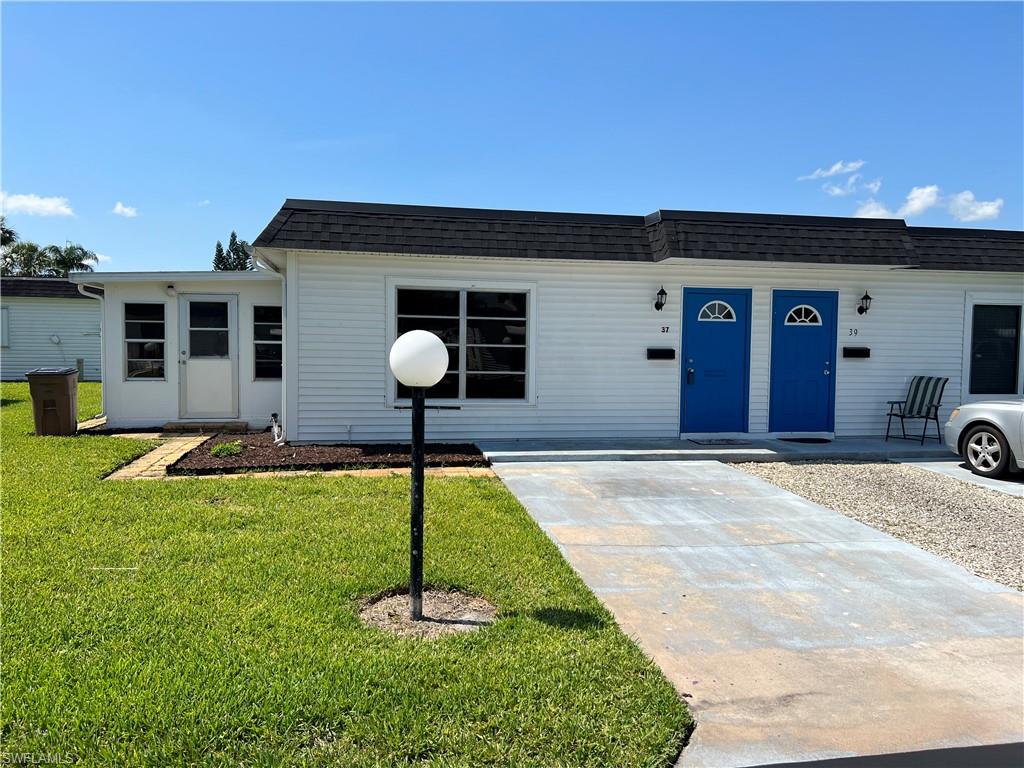 Affordable two bedroom two bath in popular Orange Grove Park. 15 X 10 Florida room with pocket sliding doors from the kitchen, NEW ROOF IN 2020, NEW CENTRAL HEAT AND AIR in 2015, new water heater in 2014, ceramic tile and wood laminate floors throughout, newly remodeled kitchen with newer cabinets and countertops, extra cabinets installed for pantry space, newer interior panel doors, newer vanities and high top toilets in both bathrooms, indoor laundry area with stack washer and dryer, walk in closet in guest bedroom, 55+ community, walking distance to the stores etc, lowest monthy maintenance fees in Lehigh.