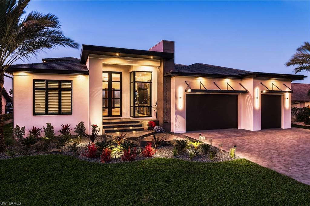 Welcome to the epitome of modern sophistication and timeless design with our stunning new construction home by Windward Construction. This exceptional residence exudes elegance and boasts an array of luxurious features that will leave you in awe. The gas cooktop in the beautifully designed kitchen takes culinary experiences to new heights, offering precision and efficiency for the aspiring chef. Prepare to be amazed by the massive outdoor entertainment area, perfect for hosting unforgettable gatherings with family and friends. Lounge in style beside the infinity edge pool, enjoying the serene views of the 200+ foot intersecting canal. The outdoor space is thoughtfully designed to provide a seamless transition between indoor and outdoor living, creating an inviting ambiance for relaxation and entertainment. Custom-designed decorative ceilings and wood floors add a touch of elegance and grandeur to the home. To truly appreciate the stunning surroundings, head up to the second-story observation deck. Don't miss the opportunity to make this masterpiece your own and experience the pinnacle of luxury living.