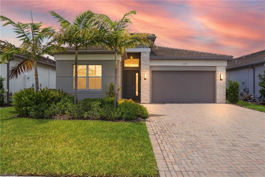 Welcome to this light-filled, move-in ready 2-bedroom + den, 2-bath residence in the highly desirable Valencia Trails, Naples' premier 55+ resort-style community. Built in 2023, this beautifully maintained home offers an open-concept floor plan designed for comfortable everyday living and effortless entertaining. The spacious kitchen flows seamlessly into the dining and living areas, creating a bright and inviting atmosphere. The versatile den provides the perfect space for a home office, hobby room, or additional guest accommodations. The private owner's suite features a generous walk-in closet and an en-suite bath, while the split-bedroom layout offers privacy for family and guests. Step outside to enjoy the Florida lifestyle from your outdoor living space, all within a vibrant, amenity-rich community offering a spectacular clubhouse, resort-style pool, restaurant, fitness center, pickleball, tennis, walking trails, and an active social calendar. Ideally located near shopping, dining, entertainment, and Naples' world-famous Gulf beaches, this exceptional home is ready for you to move in and start enjoying the lifestyle you've been dreaming of.