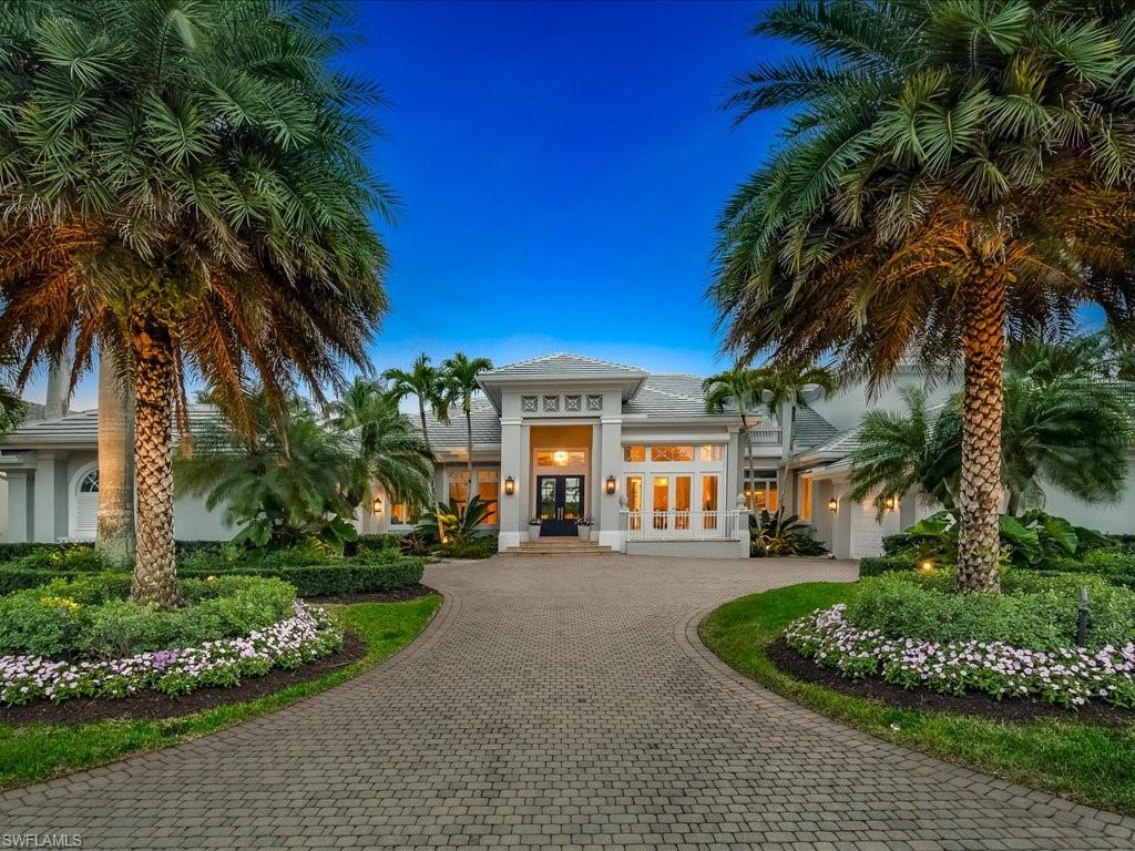 Immediate golf membership available. Indulge in the epitome of luxury living with this breathtaking custom estate at 1622 Chinaberry Way, nestled in the prestigious enclave of Grey Oaks. With nearly 5,400 square feet under air, this home exudes elegance and sophistication. Nearly every inch of this residence has been meticulously updated, including a new roof, ensuring peace of mind for years to come. As you step inside, you'll be captivated by the opulent finishes and attention to detail that define this home along with spectacular views overlooking a serene lake and the 11th hole of the Palm Course. 3 expansive covered lanais allow you to embrace outdoor living, complete with a summer kitchen and a fireplace, all centered around a glistening pool and spa. The interior boasts floor-to-ceiling custom finishes, including marble floors, multiple fireplaces, and pocket sliding doors that seamlessly blend the indoor and outdoor spaces. The redesigned kitchen, adorned with marble counters and high end appliances, combines functionality and elegance. Grey Oaks is proud to offer 54 award-winning holes of golf between 3 championship courses for one of the finest golf experiences in SWFL.