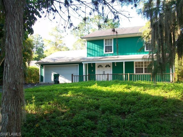 PRICE REDUCTION!  Great family home set back off of street with large wooded lot. Close in off of Pine Ridge and Logan Blvd. with inground pool on 1.14 Acres. Home has outbuilding which is great for workshop or storage. Frame playhouse apporoximately 8 ft. by 8 ft.  on property that was painted to match the home. Lots of parking area which is all paved. Home has custom oak cabinets in kitchen with lots of storage space. Spacious pantry/storage room off of laundry area. Another storage area under stairs with full size door for access. Original patio was closed in as large Florida room with sliding vinyl windows that can be opened to create a screened lanai. NOTE: Yard is very overgrown. Homes does need extensive cleaning and TLC. Handyman special! Appliances, water heater, pool equipment, and air conditioning unit are absent. This will be a short sale. Home is being sold AS IS and no repairs will be made.