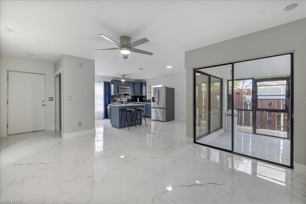 NEW PRICE FOR THIS RENOVATED TOWNHOUSE with LOW HOA FEES, NO FLOOD ZONE!!! ALL PAID ASSESSMENTS!!!MOST COVENIENT LOCATION!!! Enjoy the PRIVACY of a Single-Family Home with the Convenience of Townhouse living!!!!Offering a spacious and BRIGHT INTERIOR in a quiet neighborhood in sunny Southwest Florida. This home is featuring EXTRA-XXL TILES THROUHGOUT. The MODERN remodeled kitchen is completed with STAINLESS-STEEL appliances, sleek QUARTZ countertops, FULL SIZE GRANITE TILES BACKSPLASH and a separate kitchen ISLAND, perfect for meal prep and entertaining. The bathrooms continue the luxurious theme with a MULTIFUNTIONAL featuring MASSAGE HEADS and a QUARTZ VANITY countertop. The FULLY TILED SCREENED FLORIDA ROOM provides additional living space to enjoy the outdoors, while the PRIVATE BACKYARD offers a peaceful retreat and additional STORAGE and EPOXY floor for more comfort and convenience. With quick access to main roads and nearby city highlights, you're just minutes away from shopping, dining, and entertainment. If you are looking to downsize but still wanting to feel of a single-family home this townhouse offers the perfect blend of comfort, space and privacy without upkeep of a larger home., making this property a rare find in a fantastic location. Don’t miss out on this perfect blend of convenience, comfort, and value!