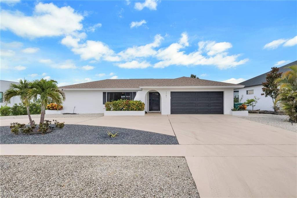 If you are looking for a high elevation home close to the beach with a private back yard with screened in pool area, then this is your home. 3 bedrooms 2 bathrooms Single family home in the estate section of Marco Island. Ranch style home with circular driveway surrounded by brand new upscale homes. Home has lots of upgrades especially concerning Hurricane related, with all new impact windows, doors and sliders, roof 2017, new AC, new pool heater and pump, new pool cage and much much more. Split floor plan offers privacy with two entertainment areas and the kitchen centered in the home, offering a reach through window to the pool area great for entertaining. Ensuite offers a single vanity with walk-in shower and a spacious primary bedroom. Guest bath was completely remodeled and also serves as a pool bath offering a shower/tub combo. Take a splash in your recently refinished pool and enjoy all the Florida Lifestyle has to offer. Close to Publix and other shops and restaurants and of course the beautiful sandy beaches of Marco Island.