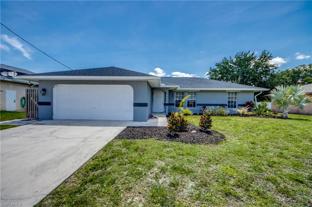 This beautifully maintained 3-bedroom, 2-bath home offers the perfect blend of comfort, style, and convenience. Step inside to an inviting open-concept floor plan featuring soaring vaulted ceilings, abundant natural light, and easy-care tile flooring throughout the main living areas. The spacious living room flows seamlessly into the dining area and kitchen, creating an ideal space for entertaining family and friends.

The kitchen is equipped with stainless steel appliances, ample cabinet and counter space, a breakfast bar, and a functional layout that makes meal preparation a breeze. The split-bedroom floor plan provides privacy for the primary suite while offering comfortable accommodations for family members or guests.

Outside, you'll find an oversized backyard with plenty of room to add a pool, outdoor kitchen, or create your own tropical retreat. The attractive curb appeal, mature landscaping, and two-car garage add to this home's appeal.

Conveniently located near shopping, dining, schools, parks, and all that Cape Coral has to offer, this move-in-ready home is perfect for first-time buyers, seasonal residents, or investors alike.