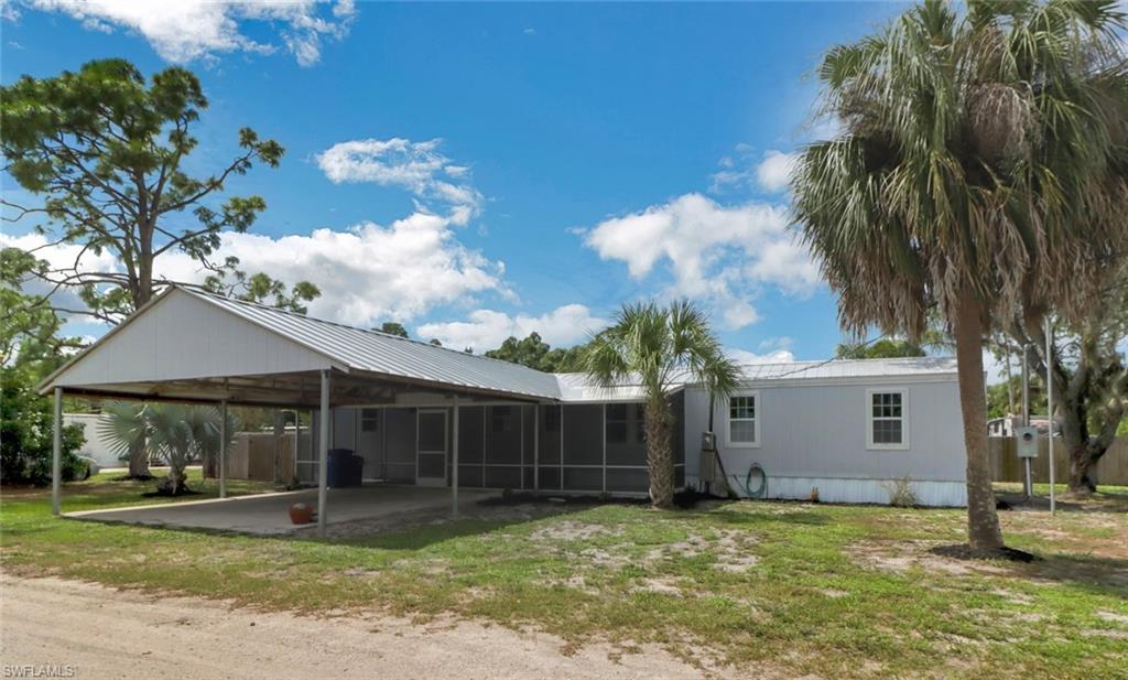 Completely remodeled manufactured home steps from the Estero line. All-new kitchen with pristine shaker-style kitchen cabinets, granite countertops, stainless steel appliances, and subway tile backsplash. Master bedroom with new ensuite bathroom and tile floors. The second bathroom impresses with a designer-style tiled shower. Two more bedrooms provide plenty of space. Stay comfortable with central air conditioning and all new windows and exterior doors. New interior doors, new closet shelving, and new light fixtures round out this beautiful home! Choose to relax in the screened front porch under the ceiling fan or covered rear deck. The home was fully painted inside and outside. The large shed with electricity, plumbing, and washer/dryer connections makes a great space for hobbies or a workshop. New water filtration system. Two-car carport! Nice quiet neighborhood and near the Miromar Outlets, Sprouts, and the best restaurants around!