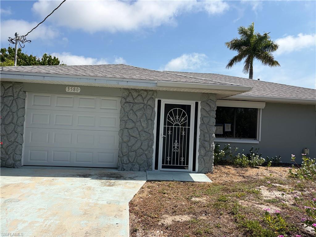 Completely renovated, move-in ready waterfront home on Pine Island with direct Gulf access via intersecting canals. This home features a new roof, drywall, upgraded kitchen with breakfast bar, new bathrooms, fixtures, and fans. Enjoy peace of mind with hurricane shutters on all windows. The expansive, air-conditioned sunroom, accessible from the living room and master bedroom, offers panoramic canal views. Freshly painted inside and out, this home feels modern and bright. Located on a quiet dead-end street, it's minutes from the Gulf and includes a functional boat lift, dock, shed, and fruit trees. Embrace island living with boating, kayaking, and fishing right from your backyard.