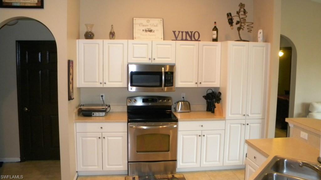 This one is really HUGE! 1800 + square feet under air, private screened lanai overlooking lawn and canal. Plus there's room for a pool. Stainless appliances and many upgrades through out.  This home is very private and features 2 walk-in closets 3 bedrooms and 2 baths. Seller has just installed cage over equipment, too. Active Alarm system in place! Offered AS IS with Right to Inspect. Submit on FR BR AS IS 1 most recent version with proof-of-funds for cash or strong pre-qual with proof-of-cash to close AND 10% escrow to Fidelity National Title, Fort Myers.