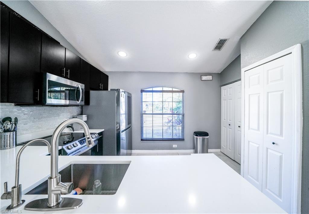 This charming cozy cottage home sits on 2.27 private acres. This modern style home has recently been updated with a new kitchen, new bathrooms, and a fresh coat of paint on the exterior of the home. The new kitchen features Quartz countertops, soft close cabinets, Samsung smart stove, Samsung microwave, & LG fridge. Enjoy the screened lanai and patio areas with southern exposure. In addition to the main home, there is a storage building on the property. There is more than enough room for a pool. Best of all NO HOA fees!!! Don't miss this opportunity to own a piece of paradise in Naples, FL!!! Home has a great location, minutes to Publix, CVS, Dunkin Donuts, schools, waterpark and recreational center.
