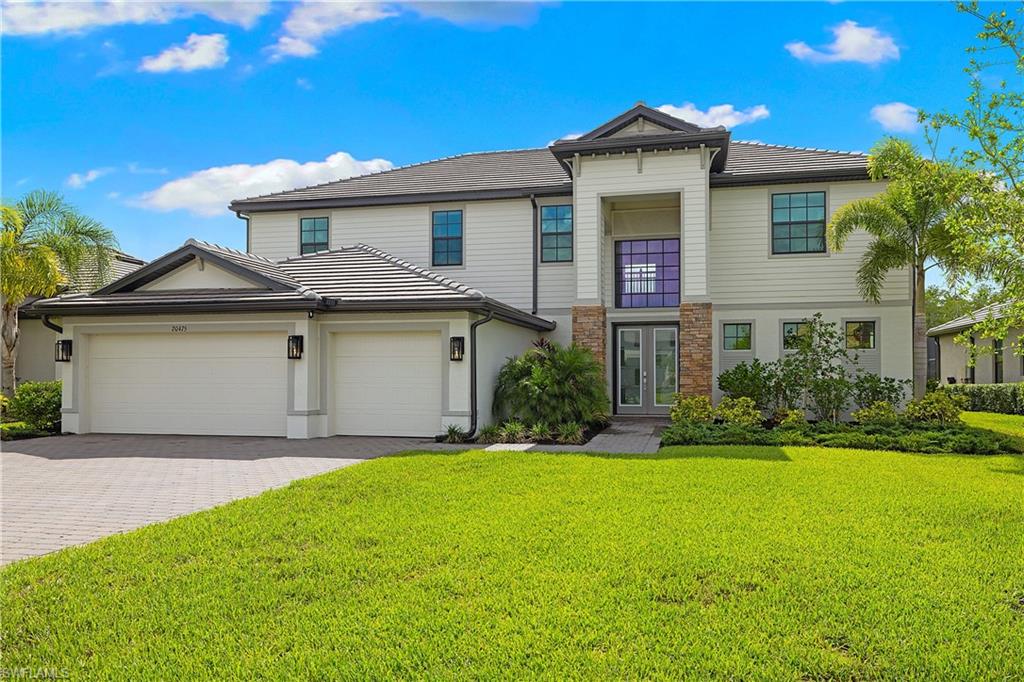 HIGHLY DESIRABLE & ELEGANTLY REMODELED “WYNWOOD” FLOORPLAN WITH 2 MASTER BEDROOMS, CUSTOM POOL/SPA AND PRIVATE, PERIMETER, PRESERVE VIEWS IS AVAILABLE NOW IN VERDANA VILLAGE! Not your vanilla, out of the box home... this MUST SEE residence is FULLY DECKED OUT with WOOD TRIM ACCENTS, FIREPLACE FEATURE WALL, REMODELED BATHROOMS and BUILT-IN CLOSET ORGANIZERS IN ALL BEDROOMS! This Spacious home offers 5 Bedrooms+ Den + Loft, 4 Full Baths, Powder Bath, 3 Car Garage, 4,027sf Living Area. Relax on the EXPANSIVE SCREENED COVERED LANAI running the entire width of the home (10’ x 60’). Take in those welcoming, "day starting" Florida sunrises over the pines and palms from your lanai with this Eastern Rear Exposure home. Enjoy the CUSTOM SALTWATER POOL/360 DEGREE SPA, PICTURE WINDOW SCREEN, RAISED WALL with SHEER DESCENT WATERFALL and SUNSHELF with 2 lighted bubblers. On the main level, you’ll find wood-look plank tile flooring throughout the living space, as well as the 1st Floor Junior Master Bedroom (ideal for guests who may have trouble with the stairs), Den, Powder Bath & Laundry (with cabinet, sink and additional storage under the stairs). The Kitchen is appointed with WHITE SHAKER Cabinets, QUARTZ Countertops, BUILT-IN STAINLESS STEEL APPLIANCES and GAS COOKTOP, Designer Gray HERRINGBONE Backsplash illuminated by UNDERCABINET LIGHTING and a passthrough window to the lanai. The Dining Area is accented by WOOD TRIM ceiling detail, upscale chandelier & sliders to the lanai. The Greatroom showcases a TV-FIREPLACE BUILD OUT trimmed with SHIPLAP and adjoined by a Den with double door entry & WOOD TRIMMED WALLS. The main living space boasts DUAL SLIDERS opening to the lanai for indoor/outdoor entertaining. The 1ST FLOOR JUNIOR MASTER SUITE has sliding glass door access to the lanai and showcases WOOD TRIM WALLS joined by a WALK IN CLOSET w/ORGANIZERS & a spa-like ENSUITE with double sinks, LIGHTED MIRRORS, ENCLOSED SHOWER with DUAL SHOWER HEADS/BODY SPRAYERS and MODERN TILE. Upstairs, you'll find the Primary Suite, 3 Guest Bedrooms, 2 Full Baths for guests, and OVERSIZED LOFT. The Primary Bedroom is appointed with 2 Walk-In Closets with ORANIZERS and a LUXURIOUS BATHROOM with Dual Sinks, ILLUMINATED MIRRORS, and ENCLOSED SHOWER with multiple shower heads and DESIGNER TILE. This home is equipped with WHOLE HOME GENERATOR, IMPACT RESISTANT Windows/Doors, WHOLE HOUSE WATER FILTRATION and REVERSE OSMOSIS SYSTEM in Kitchen, TANKLESS water heater, MINI SPLIT AC in garage and is located in FLOOD ZONE X (no flood insurance required). Amenities include Indoor/Outdoor Pickleball & Tennis, Indoor Basketball, Bocce, Clubhouse, Dog Park, Resort-style Pool & Spa, Fitness center, Movement Studio, Playground, Restaurant, Craft Beer lounge, Cafe and Indoor/Outdoor bar. Satellite amenity includes Social Room, Pool/lap lanes, Fitness Center, Sports Field. Publix Plaza outside community gates! One or more photo(s) has been virtually staged, AI generated or rendered.