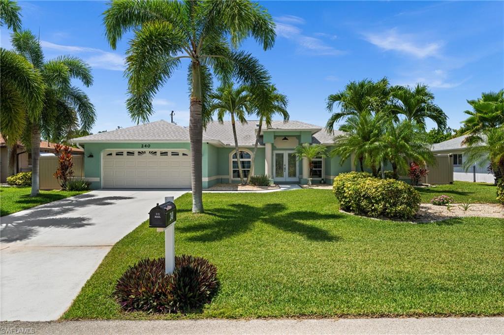 SOUTHERN EXPOSURE POOL HOME IN THE HIGHLY REGARDED PELICAN AREA OF SW CAPE CORAL! Welcome to 240 SW 37th Ln, a spacious 4-bedroom, 2-bath home offering 2,387 sq ft of living space, a private fenced backyard, and a screened saltwater pool with a paver pool deck. The southern rear exposure provides all-day sun on the pool and lanai, creating the perfect setting for relaxing, entertaining, and enjoying the Florida lifestyle. Mature tropical landscaping surrounds the property, giving it great curb appeal and a private backyard feel. Inside, the home features a split-bedroom floor plan with formal and casual living spaces, including a formal dining room, spacious living room, large family room, and breakfast nook. The kitchen offers granite countertops, stainless steel appliances, a breakfast bar, and a pass-through serving window to the family room. Double front doors, crown molding, extensive trim work, and decorative columns add character throughout the home. The large family room opens to the lanai, creating an easy indoor-outdoor flow. Additional features include impact windows, a 2019 roof, 2023 AC, 2026 Water Heater, laundry room with sink, and an oversized 2-car attached garage. NO FLOOD ZONE ( X500).Whole House Surge Protector. Centrally located near shopping, dining, Downtown Cape Coral, Tarpon Point, Cape Harbour, and everything SW Cape Coral has to offer!