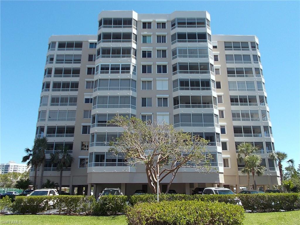 Terrific distant Gulf and bay views from this sixth floor end unit residence in one of Vanderbilt Beach's most popular high rise communities.  Enjoy the cool Gulf breezes while having an afternoon drink on one of two screened balconies.  Many recent updates include all wood grain style plank tile installed in all living areas and balconies, mostly newer décor, updated paint colors plus much more.  Pleasing light Florida style design scheme throughout with accents of beach and nautical influences.  Sofa, loveseat and chair with ottoman in the living room.  The sitting area off the living room offers a loveseat (full sleeper sofa) and rocking chair with ottoman.  The wood dining room table seats four plus there are four bar stools/chairs at the breakfast bar.  Amenities include a heated pool, tennis, covered chicki hut with BBQ grills and gated entry.  Conveniently located just across the street from the beach and minutes to shopping, dining and entertainment.