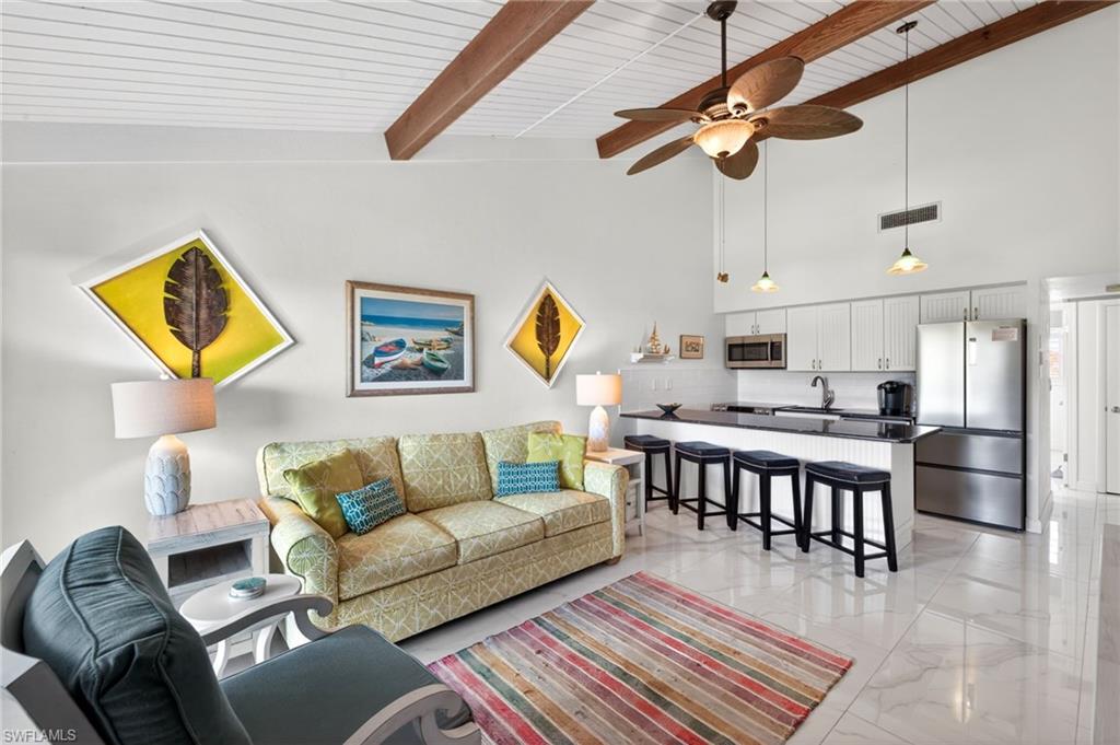 This charming Sanibel condominium is the beach retreat buyers wait for. This turnkey one-bedroom getaway offers effortless island living at an exceptional value, a rare opportunity in today’s market. Even more impressive, weekly rentals are permitted and managed by an on-island firm. This is an outstanding investment opportunity as well as a personal escape, and it's at a great price point for the island. Sold fully furnished and move-in ready, the condominium features new flooring throughout, views overlooking the community pool and a private front porch ideal for relaxing after a day at the beach. Boating enthusiasts will appreciate deepwater Gulf access, while deeded beach access with parking makes enjoying Sanibel’s world-famous shoreline easy and convenient. Immaculately maintained and ideally positioned just moments from the pool, this property combines coastal charm, income potential and island convenience in one exceptional package. Currently the only condominium available for sale in the community, this is a rare chance to secure your slice of paradise, whether for personal enjoyment, rental income or both.