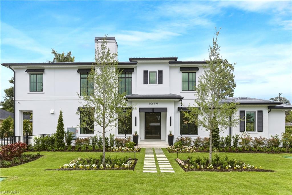 Discover a rare new construction opportunity in Sun Terrace, ideally positioned on a desirable corner lot just half a mile from the beach and minutes to downtown Naples dining, shopping, and entertainment. Built by T.B. Price Builders with interiors by Freestyle Design, this two-story residence offers 4,029 square feet of thoughtfully designed living space blending modern coastal style with high-quality construction.

The home features a dramatic great room featuring 25' ceiling, wide-plank French White Oak flooring, 10-foot impact sliders, and an open-concept layout filled with natural light. A private three-stop elevator serves all levels, including the garage, providing convenient access throughout the home.
The chef’s kitchen is appointed with Luxor cabinetry, a hidden walk-in coffee pantry, and a full Wolf and Sub-Zero appliance package. Outdoor living is highlighted by a resort-style 14’ x 42’ pool and spa, powered by propane gas and designed for both relaxation and entertaining.

Additional features include a 3.5-car A/C garage with a dedicated golf cart bay, EV-ready infrastructure, whole house generator, impact-rated windows and doors, X-500 Flood Zone and no HOA restrictions. Located near top-rated schools, parks, and local amenities, this home offers flexibility, privacy, and proximity in one of Naples’ most sought-after coastal neighborhoods.