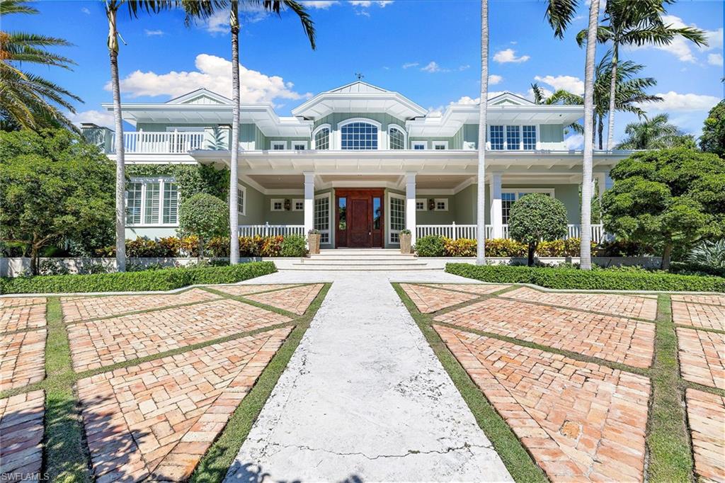 Ideally positioned just one block from the beach, this British West Indies estate, on an oversized .73-acre lot, is a rare opportunity. Featuring just under 7,000 square feet of interior living space, the expansive outdoor area includes a spacious covered lanai with inviting pool and spa, and outdoor kitchen, ideal for entertaining. High ceilings, new wood flooring and sophisticated finishes throughout offer a sense of luxury and comfort. The first-floor primary suite overlooks the backyard private oasis and lushly landscaped grounds, while the second level features a study, additional living space, four generous guestrooms with en suites and wraparound deck. The fully renovated kitchen, formal dining area and butler’s pantry is a chef’s dream with all new appliances, wine cooler and coffee machine. A three-car garage, elevator, generator and pool bath complete the northern exposure home. The anticipated new Four Seasons Beach Club, and downtown restaurants and shops are just a short distance away!