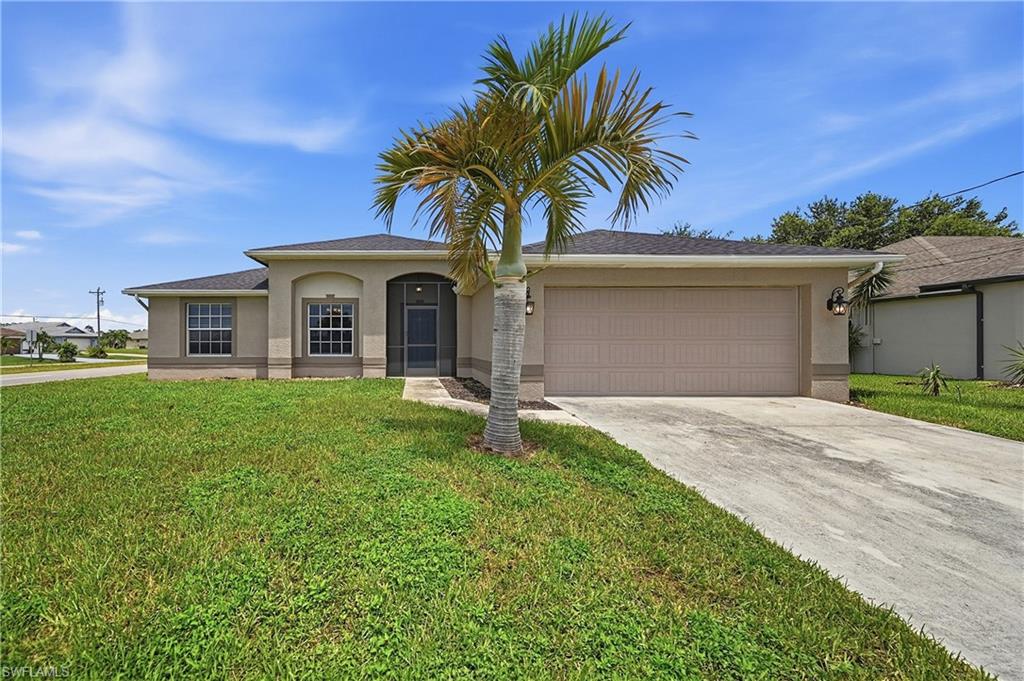 Welcome to this beautiful 3-bedroom, 2-bath home offering over 1,800 square feet of comfortable living space on a spacious lot in Cape Coral. Built in 2006, this move-in ready residence features a thoughtfully designed split floor plan, vaulted ceilings, and an expansive open-concept living area that creates a bright and inviting atmosphere.
The spacious great room flows seamlessly into the kitchen and dining area, making it ideal for everyday living and entertaining. The kitchen is equipped with stainless steel appliances, abundant cabinetry, a pantry, generous counter space, and a breakfast bar for casual dining. Large windows throughout the home allow for an abundance of natural light while maintaining a warm and welcoming feel.
The primary bedroom offers tray ceilings, a walk-in closet, dual vanities, a soaking tub, and a separate walk-in shower. Two additional bedrooms and a full guest bathroom are located on the opposite side of the home, providing a functional layout with added privacy.
Step outside to the oversized screened lanai overlooking the expansive backyard, offering endless possibilities for outdoor living, gardening, or creating your own custom pool. The big corner lot provides plenty of space to enjoy Florida's outdoor lifestyle.
Additional features include tile flooring in the main living areas, wood-look flooring in the bedrooms and great room, an interior laundry room, and two-car garage.
Conveniently located near shopping, dining, schools, parks, and major roadways, this home offers easy access to everything Cape Coral. Whether you're looking for a full-time residence, seasonal getaway, or investment opportunity, this property is ready for its next owner to make it their own.