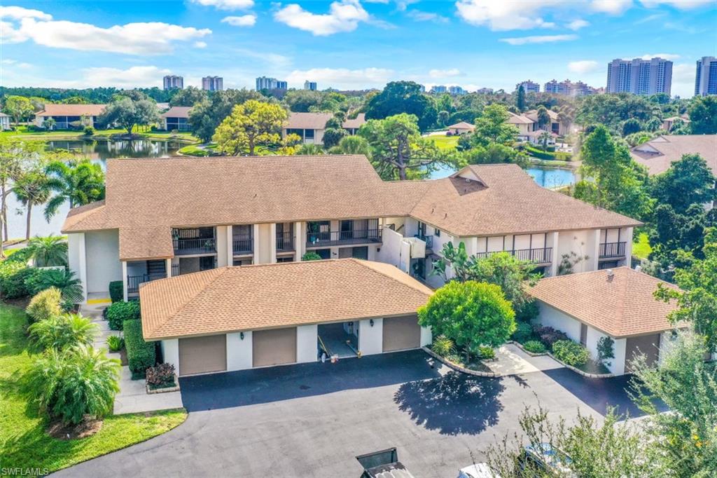 The Retreat at Naples is the best kept secret in all of Collier County! Located within the gated community of Bentley Village, this independent condo community of 78 condos has all of the great amenities you would expect in an upscale neighborhood and all of the conveniences of this great location.  This rarely available 2nd floor end unit condo has a fabulous panoramic lake view with Southern exposure for all the sunshine you've come to enjoy all day long here in Florida! Large Master suite with lake views, walk in closets and Master bath with linen closet. Your guests will love the large guest bedroom  that offers privacy with charming balconies off two sides also offering lake views. This bedroom has an adjoining guest bath, and serves dual duty as Den/Office/Computer area as well.  Detached garage has buit in workbench, bicycles, and beach chairs. The best part of the Retreat neighborhood is the location, just exit the back entrance  and you're minutes to Gulf Beaches. Or exit the main gate and you are within minutes to multiple 5 star restaurants, the Mercato shops, Whole Foods, Trader Joes and more! 
Just steps to the community heated pool.  Offered Turnkey furnished.