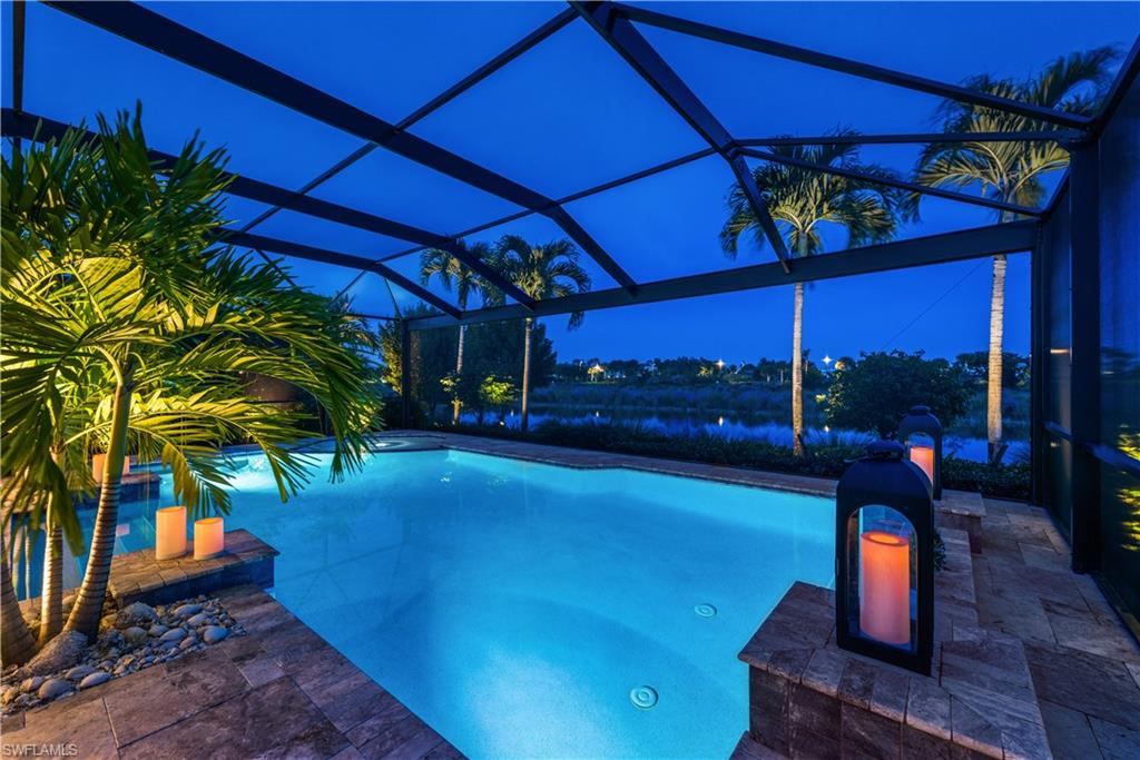 Sliding glass walls disappear, ushering in a spacious outdoor living area with a picture screen enclosure. Idyllic waterfront pool setting highlighting travertine stone lanai with custom outside the kitchen. Minutes from downtown Naples, nestled in the acclaimed community of The Isles of Collier Preserve. This Alamanda floor plan offers valuable upgrades complete with impact windows, doors, tile plank floors, a gourmet kitchen with stainless steel appliances and quartz countertops, fine millwork, en-suite guest bedrooms, high ceilings and so much more. The dining area combines comfortable family time or guest entertainment. Enjoy the charming “Old Florida” inspired clubhouse, state-of-the-art fitness center, resort-style pools, cabanas, walking trails, pickleball, tennis, bocce and more. End your day of fun in the sun with dinner at the Overlook Bar and Grill. Excellent location in Naples to call home. Live in this pristine home and enjoy the vibrant new community where the magic of Old Naples and nature still coexist. Over $75,000 in upgrades after market.