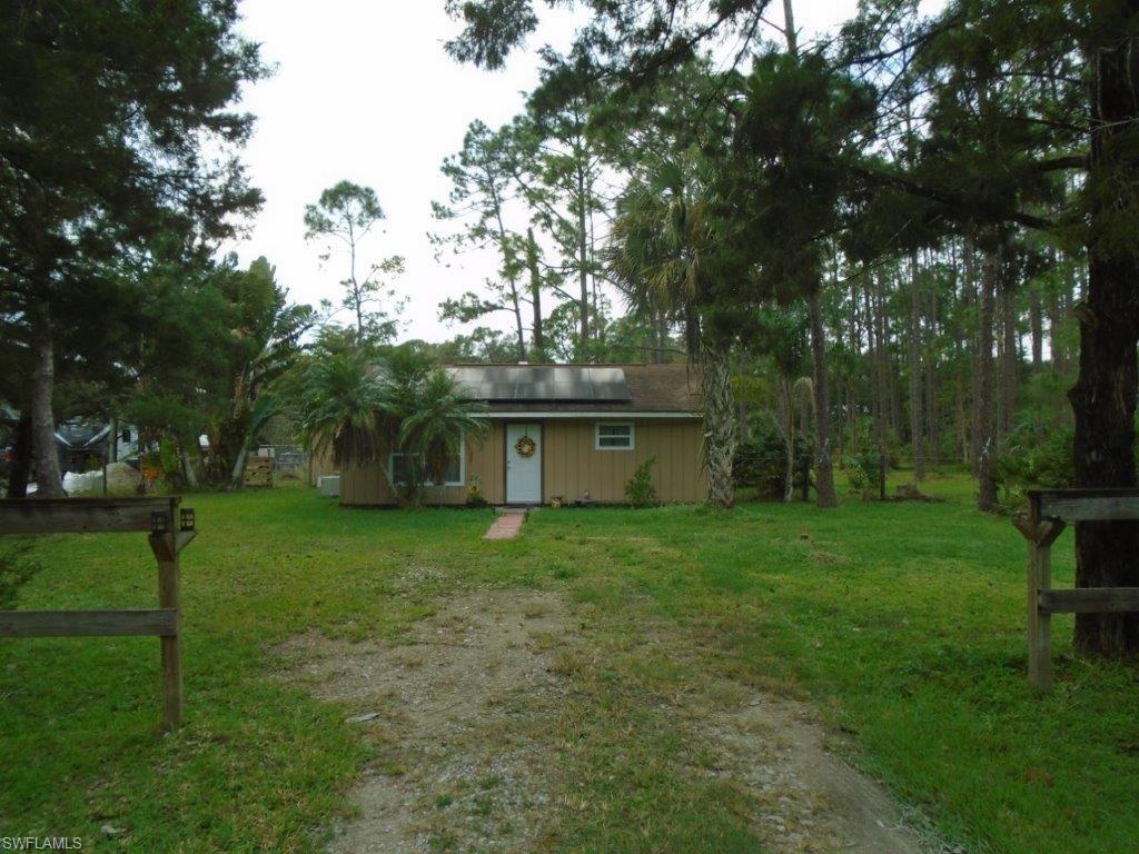 COUNTRY CUTE!!! 1.3 ACRES (fenced), 2 bedroom remodeled home with large DEN / Game room / office / etc., +++ a 2500 SF CARPORT/Pole barn? with 500 SF office or apartment !!! 540 SF wood deck porch/lanai on back of home with FIRE PIT area!!! 60+ trees ! True COUNTRY living, but minuets from town!!! 1 mile from I-75!!! This is truly a great little home with a really nice piece of PROPERTY and room to expand /grow!! ***Sellers installed $25,000 SOLAR SYSTEM  @ beginning of the summer -SYSTEM saves $100+ per month on the electric bill!!! - system included in sale!***