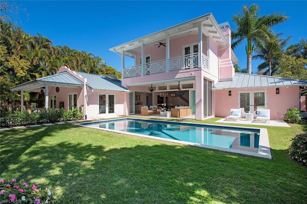 The "Pink House" is a rare and captivating offering, blending timeless elegance with vibrant Palm Beach flair. This beautifully reimagined and fully upgraded two-story residence presents an exceptional opportunity to own a true "Florida chic" retreat in the highly coveted Park Shore neighborhood, quietly tucked away on a serene street. The home was taken down to the slab and completely rebuilt in 2006 and is all concrete block and poured concrete 2nd floor. Thoughtfully elevated with extensive high-end improvements throughout and located in the desirable X500 Flood Zone, impact resistant windows and doors, this home provides both style and peace of mind-ideal as a carefree seasonal escape or a full-time coastal sanctuary. The gourmet kitchen is appointed with upgraded appliances, including Sub-Zero and Wolf appliances, while outdoor living is enhanced by a new stunning saltwater pool, creating the perfect private oasis for relaxation and entertaining. Park Shore residents enjoy exclusive access to a private, guarded, gated beach entrance for a nominal fee. Just across from the beach access, Venetian Village offers waterfront dining, boutique shopping, charming cafés, ice cream shops, and the Park Shore Marina. Waterside Shops and Artis—Naples are just moments away for luxury retail and cultural entertainment. Perfectly positioned west of US-41, between the Ritz-Carlton and Mercato to the north and the iconic 5th Avenue South and 3rd Street South to the south—with the new Four Seasons only minutes away-this location truly offers the best of Naples at your doorstep.