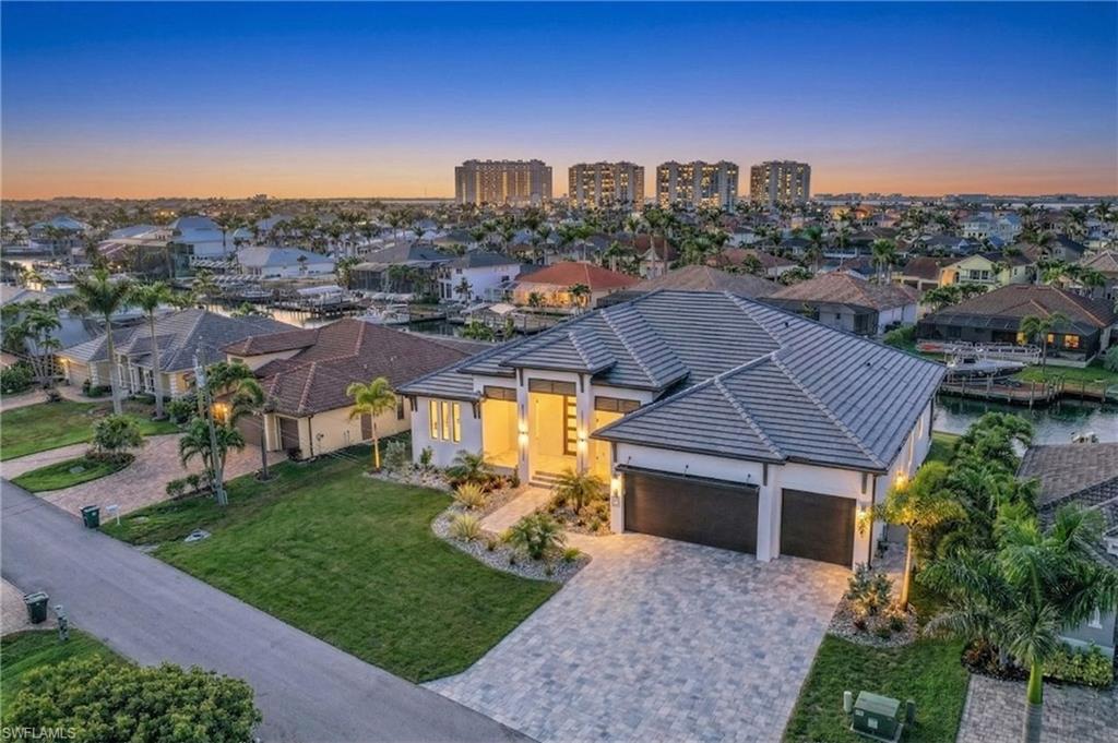Rare opportunity to own a triple lot with direct sailboat Gulf access in one of Cape Coral’s most prestigious waterfront neighborhoods, located directly across from Cape Harbour and within walking distance to waterfront dining, boutique shopping, and live entertainment in one of the city’s most sought-after luxury communities.

This is a truly oversized homesite, offering 120 feet of waterfrontage compared to the standard 80 feet, and spanning approximately 0.34 acres versus the typical 0.23-acre lot. The additional width and depth provide the flexibility to build a larger custom luxury residence, incorporate a multi-car or RV garage, and still maintain valuable green space for privacy between neighboring homes—an increasingly rare feature in high-end Cape Coral waterfront areas.

Oversized lots like this are extremely hard to find, especially on established, high-end streets surrounded by custom waterfront estates. This property offers the opportunity to design and build a home that truly stands out and maximizes both scale and waterfront presence.

Positioned with desirable southern exposure, the lot sits on a wide 100+ foot canal and includes an existing seawall, saving both time and significant construction cost. The property is cleared and ready to build, making it ideal for buyers looking to move forward quickly on a custom waterfront home.

Boaters will appreciate the premium deep-water sailboat access with no bridges and no locks, allowing for quick and unobstructed access to the Caloosahatchee River, Gulf of Mexico, and world-class boating destinations including Sanibel, Captiva, and Boca Grande.

Located just steps from Cape Harbour, residents can enjoy a vibrant waterfront lifestyle with dining at Rumrunners, Fathoms, and The French Press, along with boutique shopping, art galleries, live music, car shows, and seasonal events—all within walking distance.

All city utilities are in place and assessments are paid, adding further value and convenience. This property represents one of the most desirable buildable Gulf access lots in Cape Coral, combining location, size, exposure, and boating access.

Whether you are searching for a luxury waterfront homesite, a direct Gulf access property, or a rare oversized lot near Cape Harbour, this is an exceptional opportunity to build a custom estate and experience the best of the Southwest Florida waterfront lifestyle. *Listing is for a lot only* Home is for example. Photos shown are of the Barrington II model from the Signature Series by award-winning custom home builder. Floor plans, specifications, and additional information available upon request.