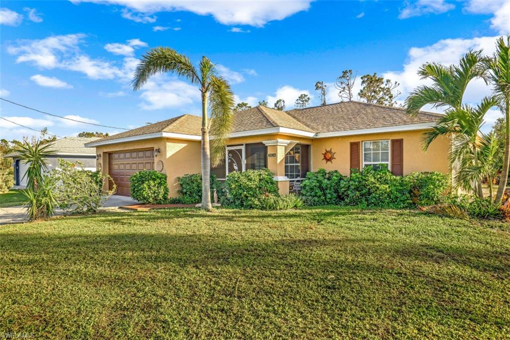 Come enjoy this southern exposure, Completely Turnkey, pool home ( with a pool heater) in the popular NW Cape Coral West of Burnt Store Road, that sits on an oversized lot and has extreme privacy! The exterior of the home has been recently renovated with a new roof, pool screens, pool pump, and a water system. The backyard has a great wooded view that creates the privacy for the home. Inside the home are cathedral ceilings, den/office, and an open living floor plan with a seamless transition between the living room and kitchen.  Sliding glass doors that are wind-impact proof up to 135 mph line the living and breakfast room for views of the lanai. The owner's suite sits right off the breakfast room. This home is located just minutes from the harbor, shopping, and dining.