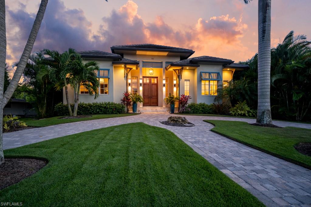 On one of the prettiest, most desirable blocks in Old Naples you will find this timeless, luxurious 5 bedroom 5 1/2 bath home drawn by Falconer Jones and built in 2016. The open floor plan is perfect for easy entertaining as all main rooms have walls of 10' sliders opening to the gorgeous outdoor living area. The travertine pavered lanai features a gas heated pool and spa with changing colored lights, an outdoor living room with TV and gas fireplace, and a separate summer kitchen / bar area. The heart of the home is the gourmet kitchen with Wolf gas range and convection wall ovens with steamer, Subzero refrigerator, 2 Perlick wine coolers, 2 Miele dishwashers, huge center island & buffet serving station. First floor master retreat features his & hers walk-in closets, bubble soaking tub, oversized shower w/large bench, 3 body jets, rain head, regular head, & handle held unit! Light Oak floors throughout, whole home impact glass, 3 car garage on the alley, a concrete 2nd floor, generator & elevator ready, Sonos system, electric blinds & 3 A/C units w/separate zones. Just blocks to the beach, and the world class shopping and dining of both 3rd St S and 5th Avenue S.