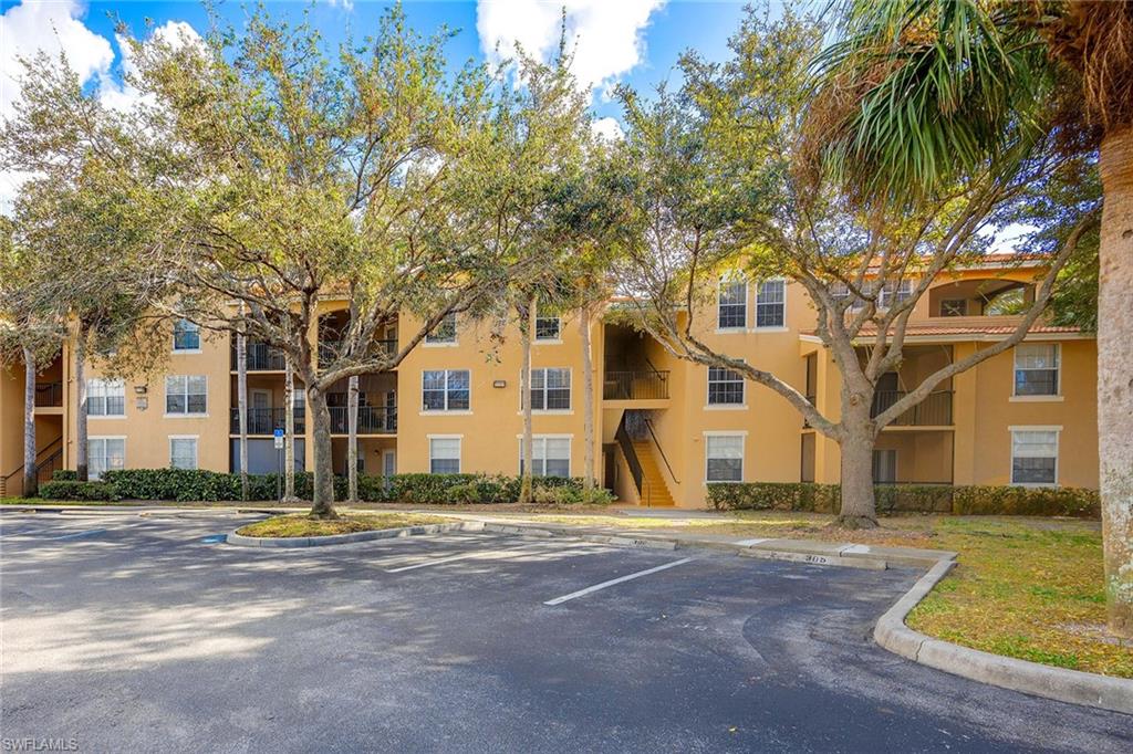 Location, location, location. Fresh and coastal, this beautifully updated second-floor condominium in Sanctuary at Imperial River features two bedrooms, two baths, an open kitchen, a split-bedroom floor plan, a screened balcony with a privacy shade, and a rare INCLUDED ONE-CAR GARAGE! Thoughtfully updated, the home received a new air conditioner, water heater, washer, stove, refrigerator, blinds, and ceramic flooring in 2023. In 2022, updates included new carpet, light fixtures, fresh interior paint throughout, a new shower, and two comfort-height toilets with soft-close lids. Additional improvements include a new garbage disposal and smoke detectors. Ideally located just off U.S. 41, north of Bonita Beach Road, the community is moments from Starbucks, Fresh Market, Bonita Bay Promenade, the Imperial River boat ramp, and Bonita Beach, just 3.4 miles away. The building's roof was replaced in 2020. Community amenities include a gated entrance, clubhouse, heated pool and spa, fitness center, tennis, pickleball, racquetball, a fenced play area, barbecue and picnic area, and more.