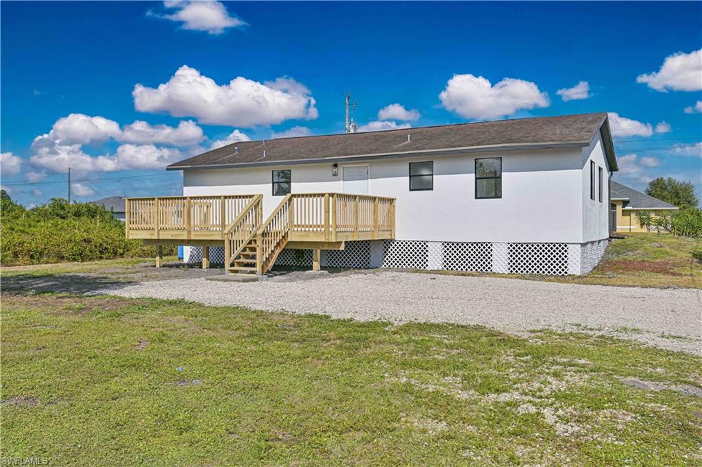 Buyer's financing fell through. Welcome to this Stunning renovated home In Lehigh Acres. The property has been totally renovated from top to bottom like a new home. Step inside, you'll be greeted by stunning porcelain tile that graces the entire house with 5 inches base board gives it the modern feel. The Living room, open concept with kitchen and dining room offers great practical space for family and friends gathering and partying. This luxury kitchen carries brand new hardwood cabinets with soft closing features, beautiful quartz countertops, peninsula with waterfall and stainless-steel appliances, Home has brand-new LED lighting throughout the entire house. Property has new AC, Repipe, new stucco, new water heater and new electrical panel that provides peace of mind for years to come. Property is in X zone, so no flood insurance is required. Perfect huge new deck oversees practical backyard provides endless Florida outdoor living lifestyle. Hurry up before it is gone.