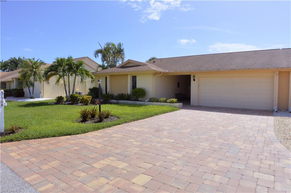 Beautifully renovated and maintained attached villa located in the newest section of Village Green in Whiskey Creek, the rear faces east so you will enjoy the morning sun as you enjoy your coffee and start your day. The kitchen offers wood cabinets, granite counters and stainless appliances, including French door refrigerator. The spacious 31 foot long lanai has been enclosed and is air conditioned. Original windows were replaced with impact windows providing an all season room that you will enjoy. Association condo fees of $400/month include basic cable, insurance on the structure, outside maintenance, landscaping, heated community pool and reserves for painting, paving, roofs and irrigation and pool maintenance. The attic has pull-down stairs and newly installed blown-in insulation. Village Green is a pet friendly (20 lbs or less) adult (55+ ) community.