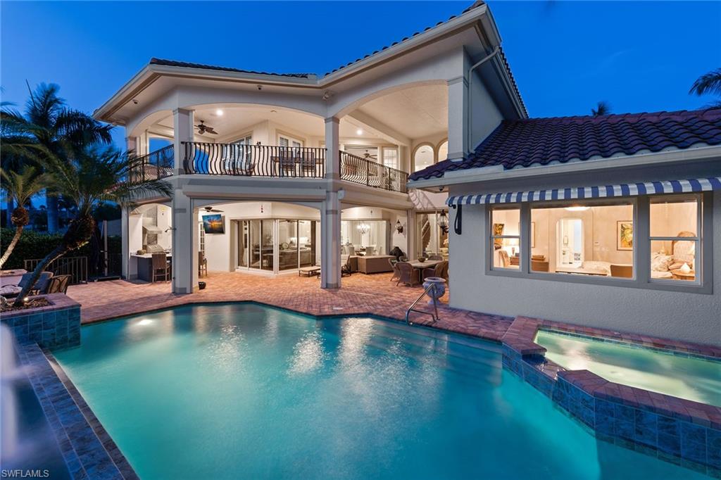 This beautifully renovated home is perfect for entertaining and easy living. With long western Venetian Bay views, relax watching the playful dolphins and colorful sunset sky. The new dock with boat lift, separate Jet Ski and kayak lift makes enjoying the water a breeze. Entertain on the lanai with resurfaced heated pool, overflowing spa and outdoor kitchen. Featuring oversized Italian ceramic tile and wood flooring, electric shades, elevator, home automation, surround sound, zero-corner sliding doors and a gas fireplace. The open kitchen boasts stunning Taj Mahal quartz countertops, Blanco sinks, Sub-Zero fridge, Viking 6-burner gas cooktop & oven, Viking dishwasher and island. First-floor master suite has beautiful bay views, 2 walk-in closets and large shower. Upstairs, guest suites have their own family room, kitchen and covered balcony with glistening bay views. Have peace of mind with 3-car garage, alarm & camera system, and new whole-house generator with 500-gallon propane tank. Located in the highly coveted and pet-friendly Park Shore neighborhood, you’ll have optional membership to the beach, and be near the best shopping, dining and entertainment Naples has to offer.