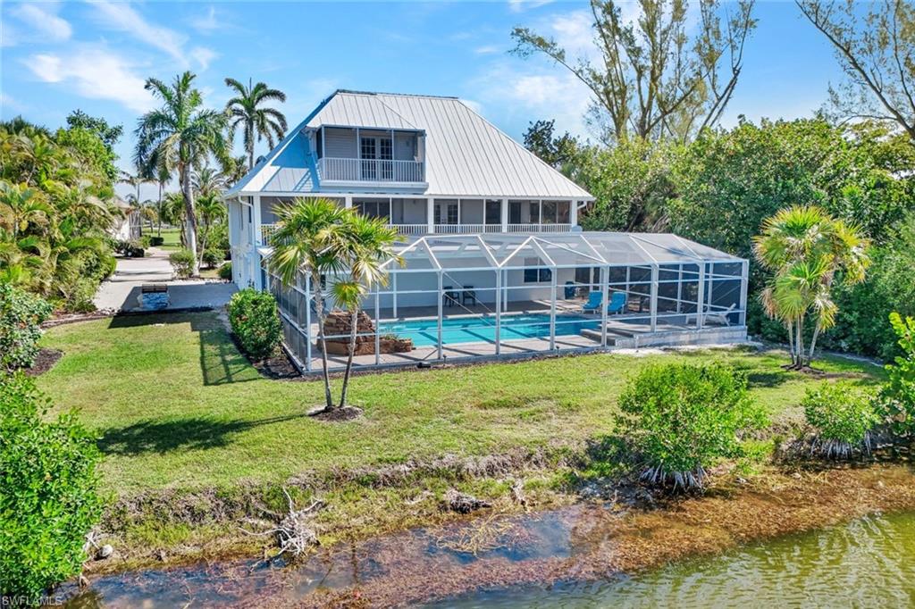 Nestled along the tranquil shores of Horseshoe Lake, this exceptional Florida-style residence offers expansive water views, upscale finishes, and the perfect blend of comfort and functionality across three spacious levels. Designed for both everyday living and entertaining, the home features soaring ceilings and an extended chef’s kitchen with granite countertops, custom maple cabinetry, stainless steel appliances, built-in oven and microwave, sleek glass cooktop, and a convenient computer nook. Just off the kitchen, a tiled veranda provides the perfect setting to enjoy peaceful lakefront vistas.

The luxurious primary suite is a true retreat, featuring dual walk-in closets and a private screened balcony overlooking the water. The spa-inspired primary bath offers a soaking tub, oversized tiled double shower, and separate lavatory and bidet rooms for added privacy and convenience. Guest accommodations are equally inviting, with custom built-ins and direct walk-out access to the lanai.

Recent improvements add tremendous value and peace of mind, including a beautifully refurbished pool and spa, a brand-new A/C system with updated ductwork, and a private elevator servicing all three floors with ease. Additional highlights include plantation shutters, electric storm shutters, security lighting, and abundant lower-level space ideal for storage, hobbies, or flex use, along with a spacious two-car garage. Best of all, the home’s living areas have remained free from damage during previous storms, offering added confidence in this well-maintained waterfront property.

Located within Sanibel’s highly desirable The Dunes Golf & Tennis Club community, this home also offers access to one of the island’s premier lifestyle destinations. Membership is not mandatory, but may be purchased to enjoy the Audubon-sanctioned 18-hole championship golf course, six Har-Tru tennis courts, and dedicated pickleball facilities—creating an exceptional opportunity for those seeking an active and amenity-rich island lifestyle.