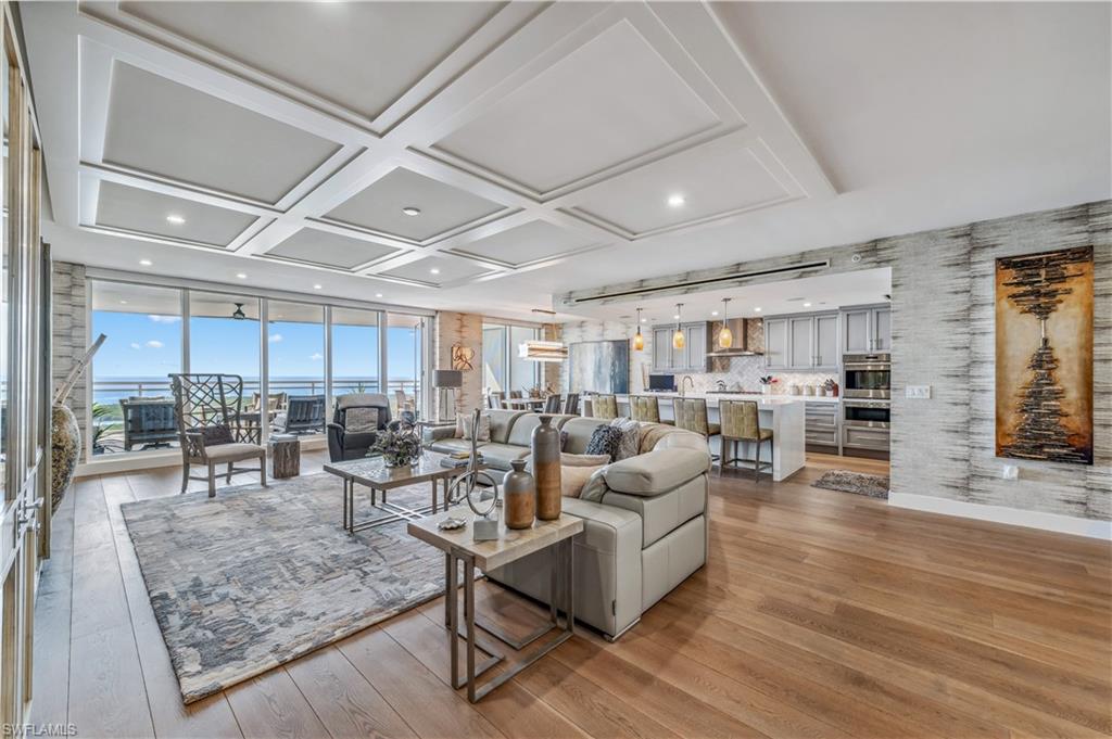 Step into unparalleled luxury with this stunning 4-bedroom, 4 bath residence in the coveted Kalea Bay. Positioned high on the 20th floor, this unit offers breathtaking views of the Gulf of Mexico, the bay, and endless sunsets from one of the largest lanais in Tower 100. Not only is the view incredible but this unit comes with TWO deeded parking spots in the upstairs garage.  Designed to impress, showcasing exquisite custom millwork, elegant designer wall coverings, and impeccable finishes throughout. The gourmet kitchen is a chef's dream, featuring Wolf and Sub-Zero appliances, a large waterfall island, and a spacious butler’s pantry. Open-concept living and dining areas flow seamlessly for entertaining, while the expansive lanai provides the perfect indoor-outdoor lifestyle. The primary suite offers a private retreat with spa-like amenities, while the three additional bedrooms provide comfort and privacy for guests or family. Located in Naples' premier resort community, Kalea Bay offers five-star amenities, including rooftop and waterfront pools, a state-of-the-art
wellness center, full-service dining, tennis, pickleball, and a private beach club. Live the dream at Kalea Bay