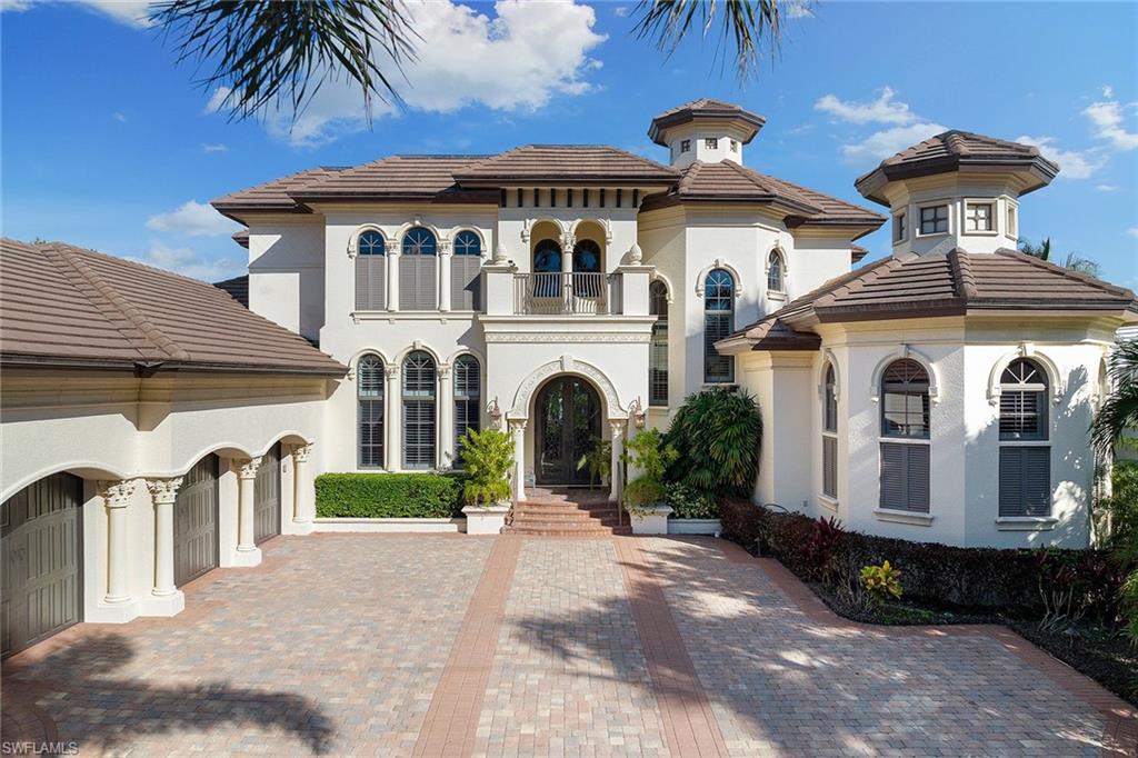 This home has NO damage from the Hurricane. Located in the highly desirable neighborhood of Aqualane Shores, this stunning waterfront home is just steps to The Gulf of Mexico, Naples Bay and the shopping and dining on Third Street. The Cantera doors open to a beautiful living room with expansive views, fireplace and full bar. Entertain guests in the formal dining room or gourmet kitchen which flows into a generous-sized family room. The expansive 4-bedroom + den residence includes a spacious first-floor master suite and private study. Three additional large en-suite guest bedrooms are located upstairs, complete with a covered balcony. A sprawling patio area with infinity pool and spa can be enjoyed year-round. This fully furnished home features multiple ceiling details, exceptional quality workmanship and materials throughout and includes an elevator, 3-car garage and generator.